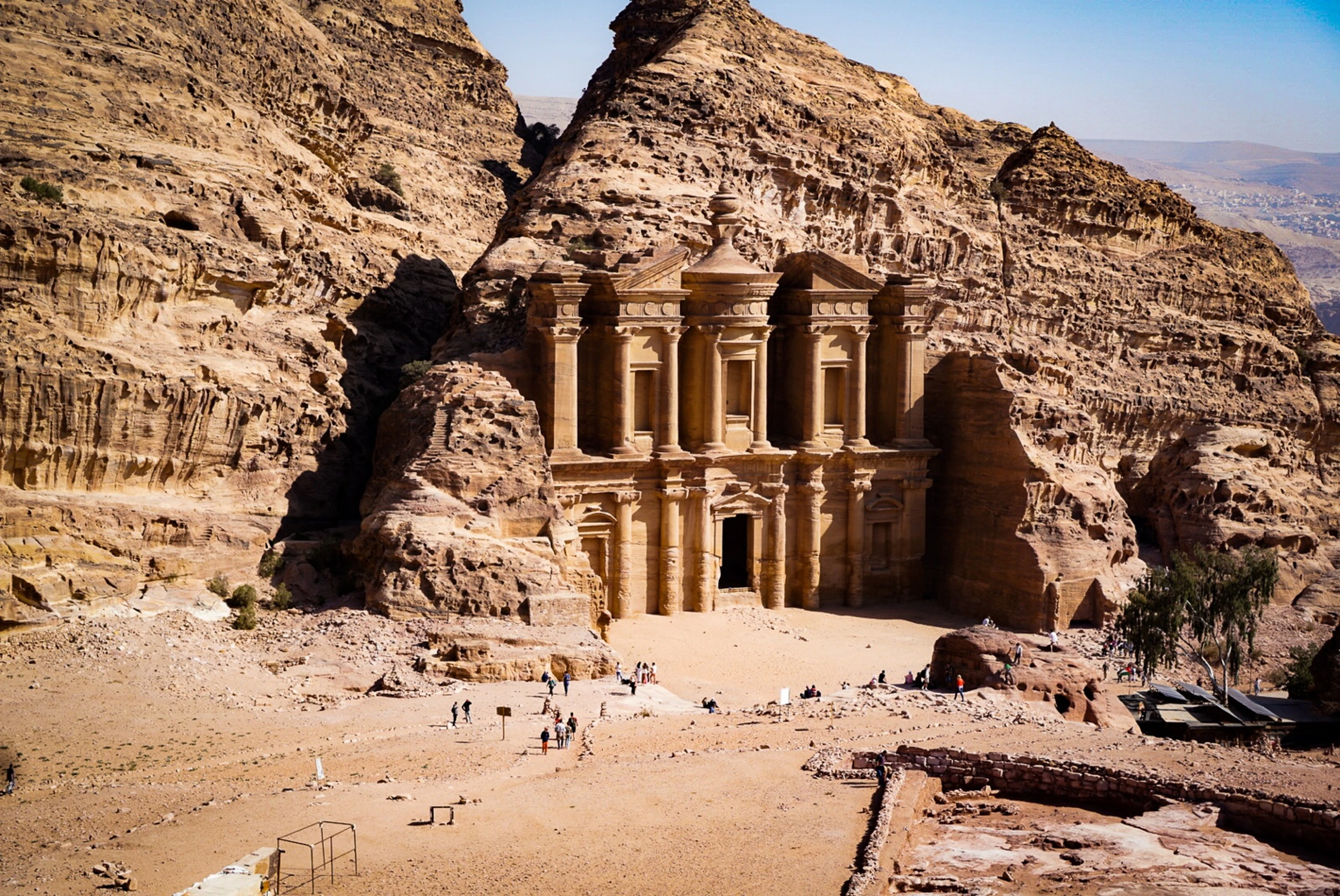 The rock-carved facade of the Monastery (Ad Deir) beneath sandstone cliffs, Petra