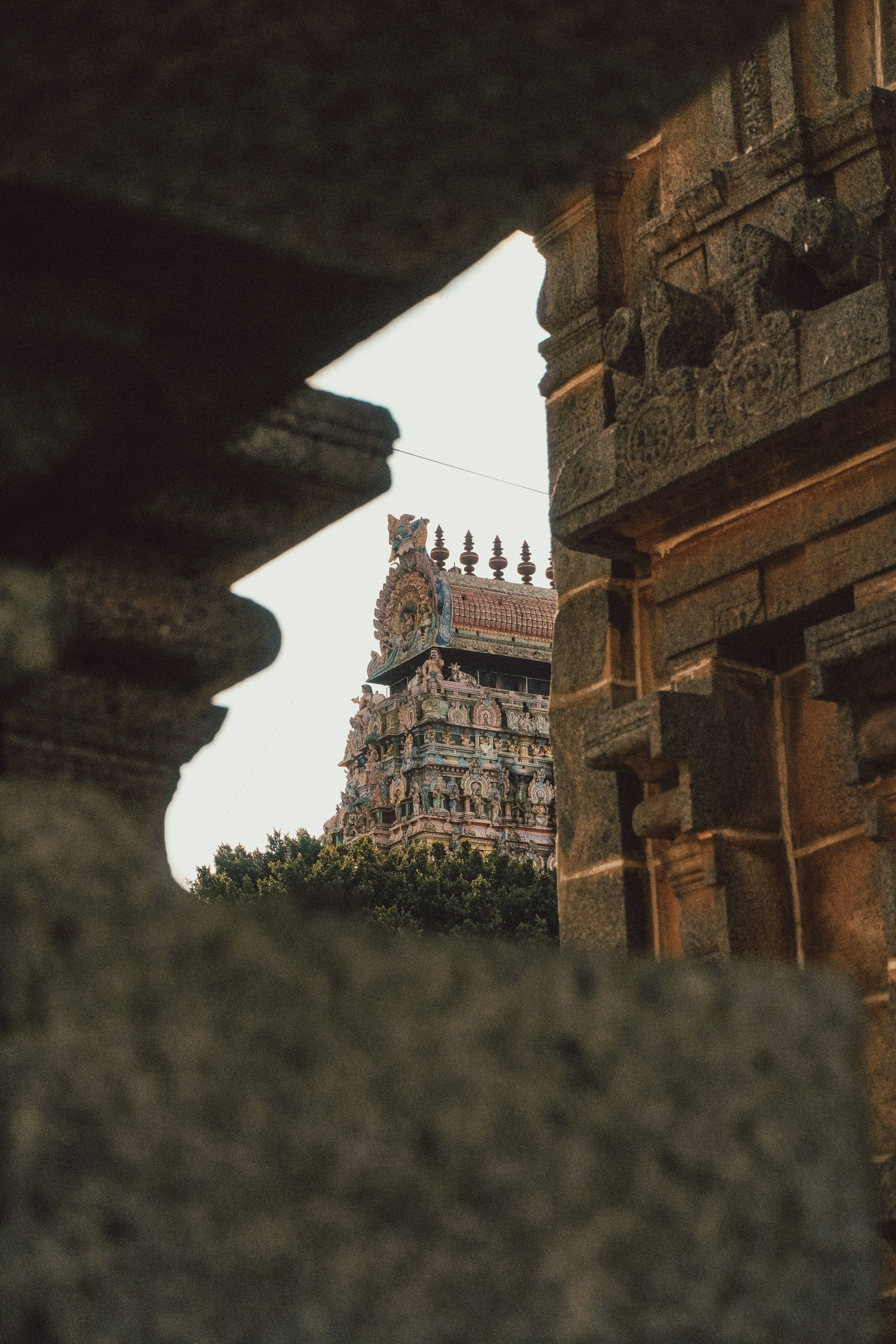 Ancient temple tower framed by stone architecture