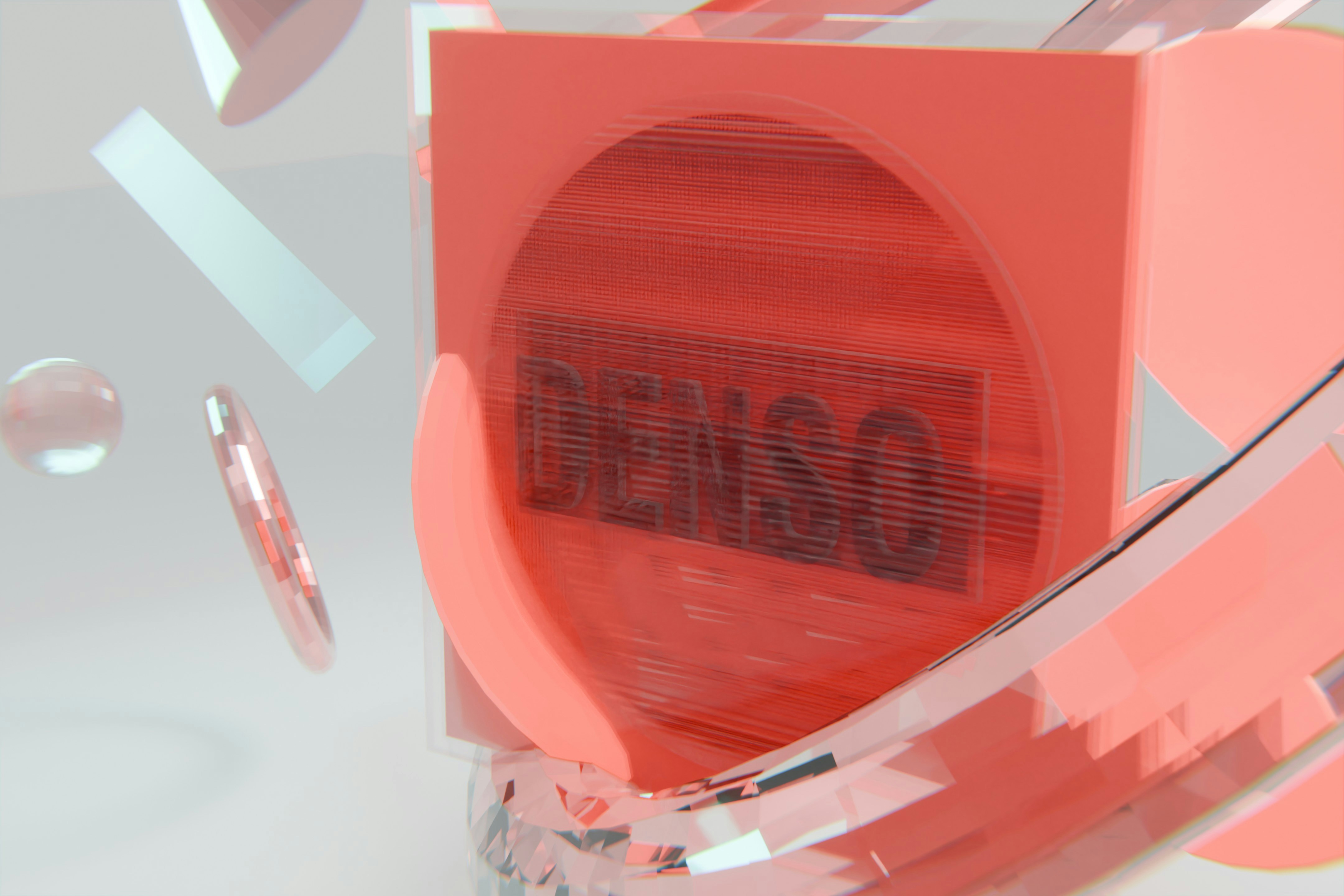 Abstract orange cube with "denso" text and geometric elements.