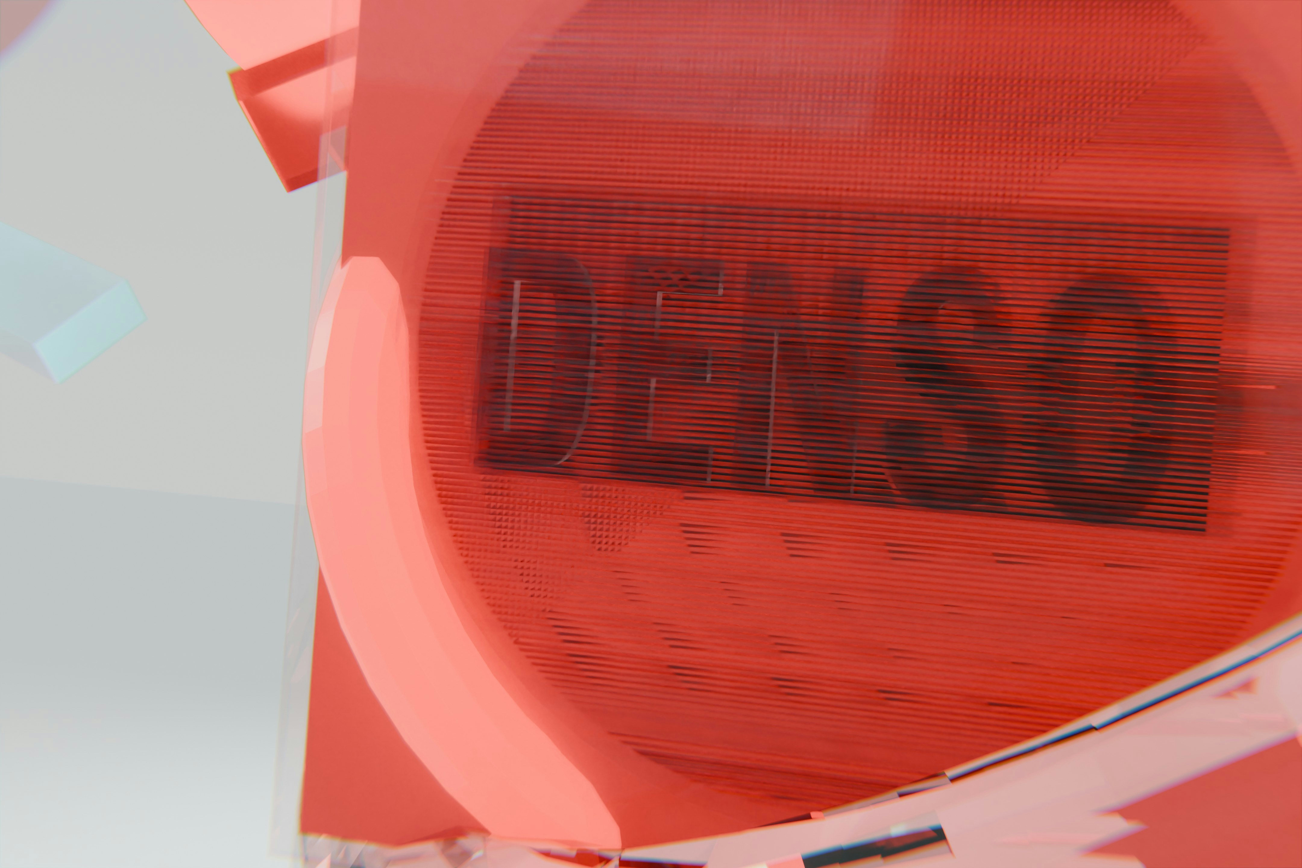 Red circular object with the word denso printed on it.