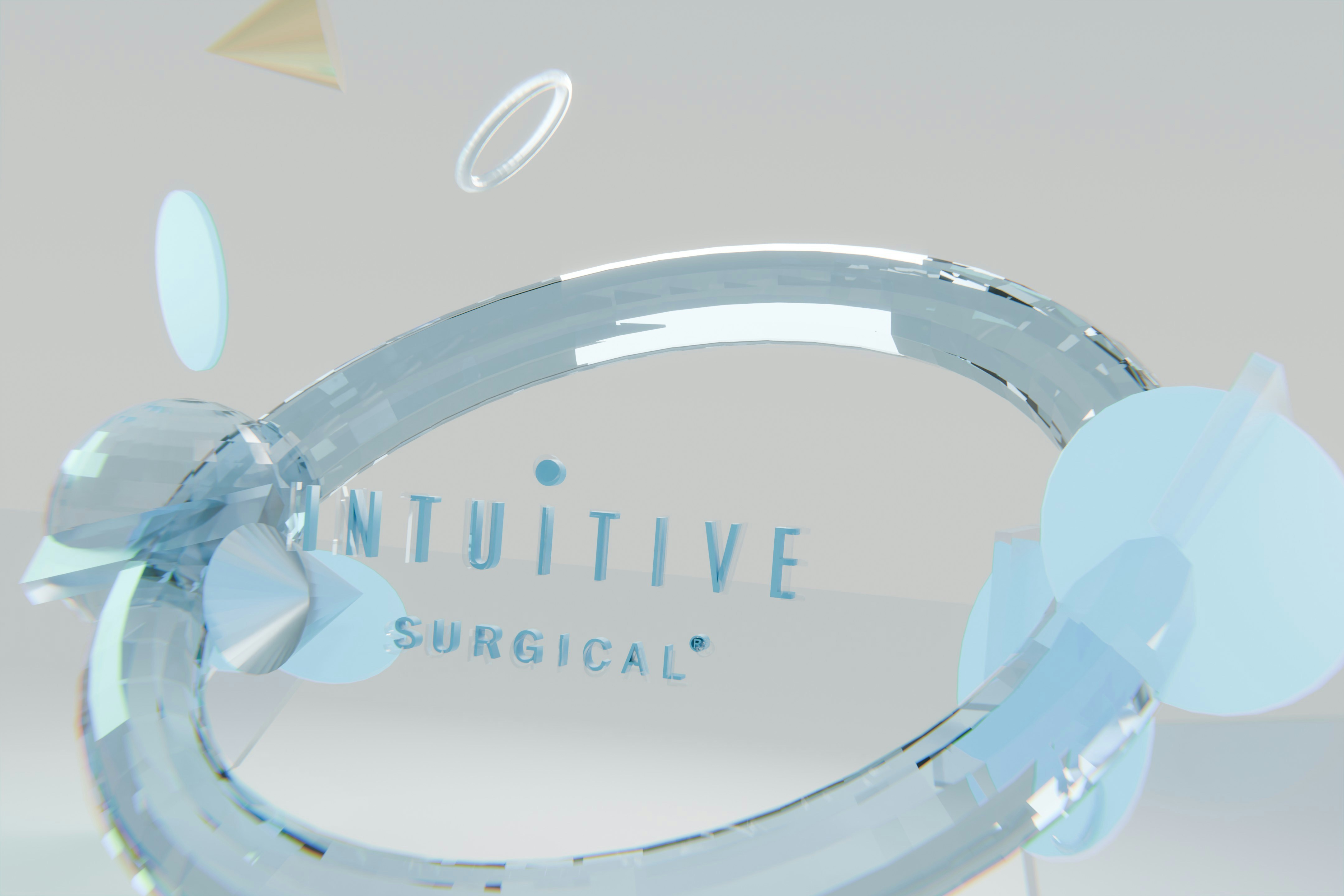 Transparent ring and abstract shapes with 'intuitive surgical' text.
