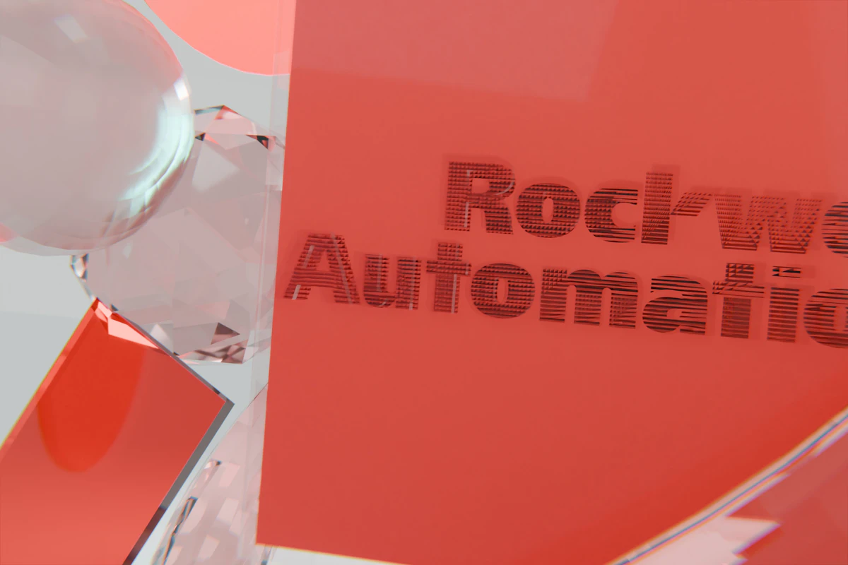 Rockwell automation text on a red surface with clear spheres