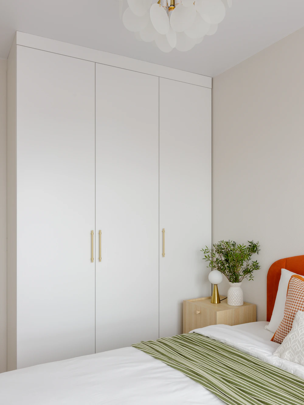 Bedroom with a white built-in wardrobe fitted to the wall