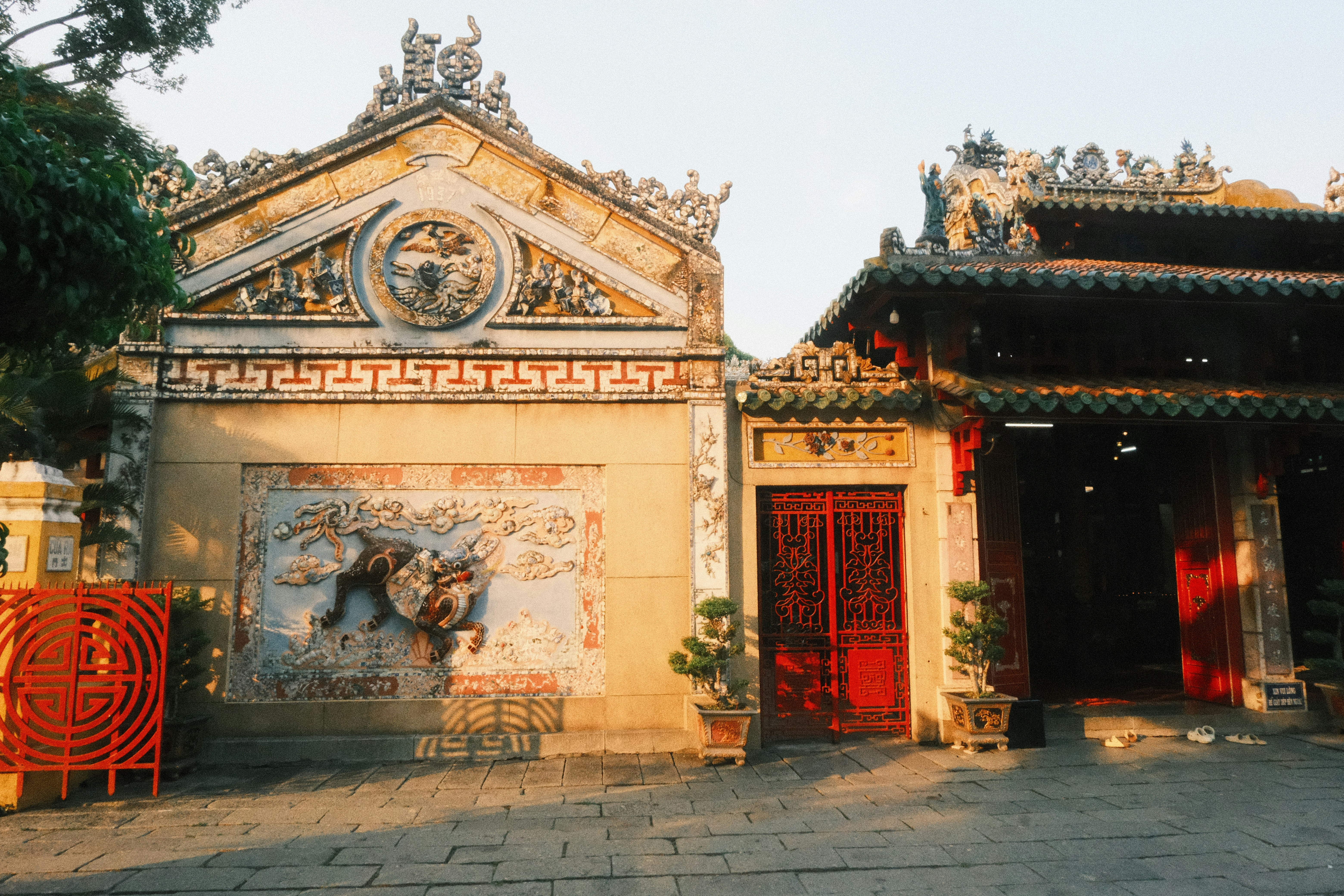 Ornate asian temple with traditional architecture and warm sunlight.