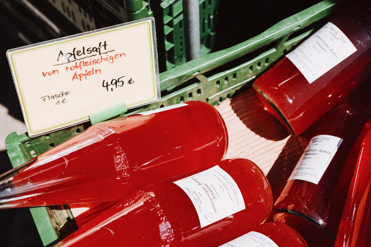 Bottles of fresh apple juice for beverage processing