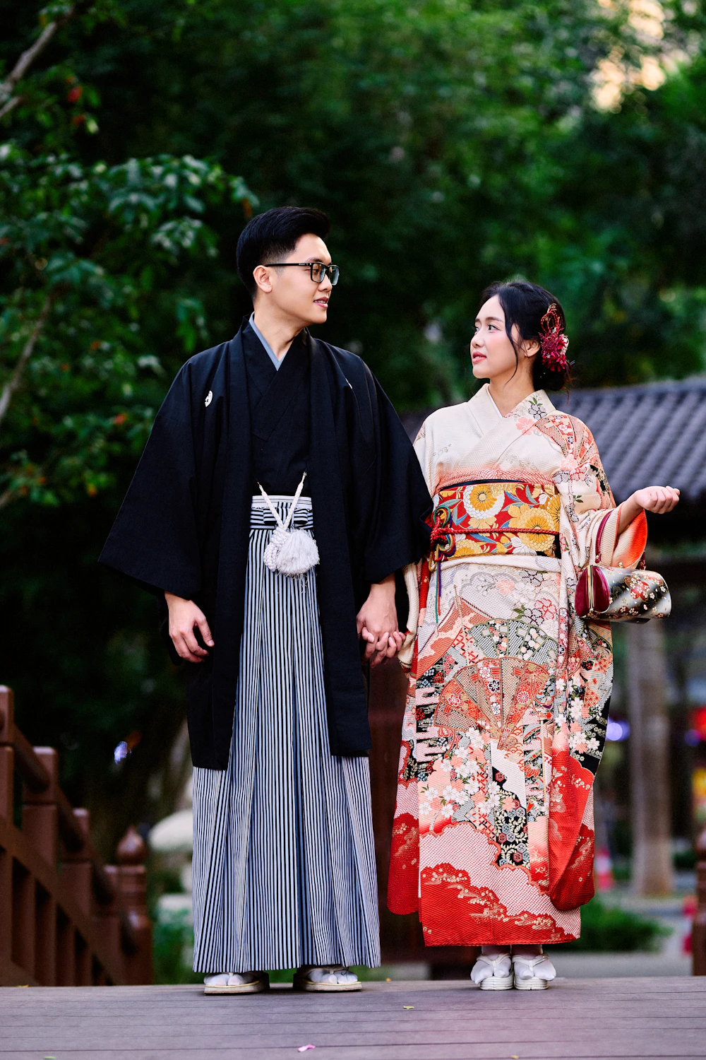 Yuna and Kai holding hands in the garden