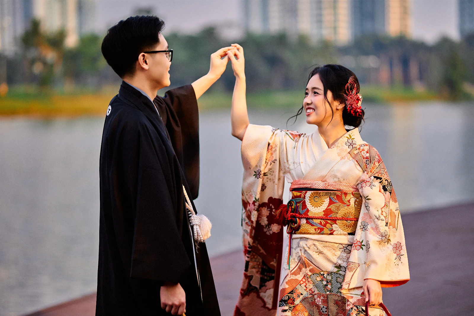 Yuna twirling by the lake while Kai holds her hand