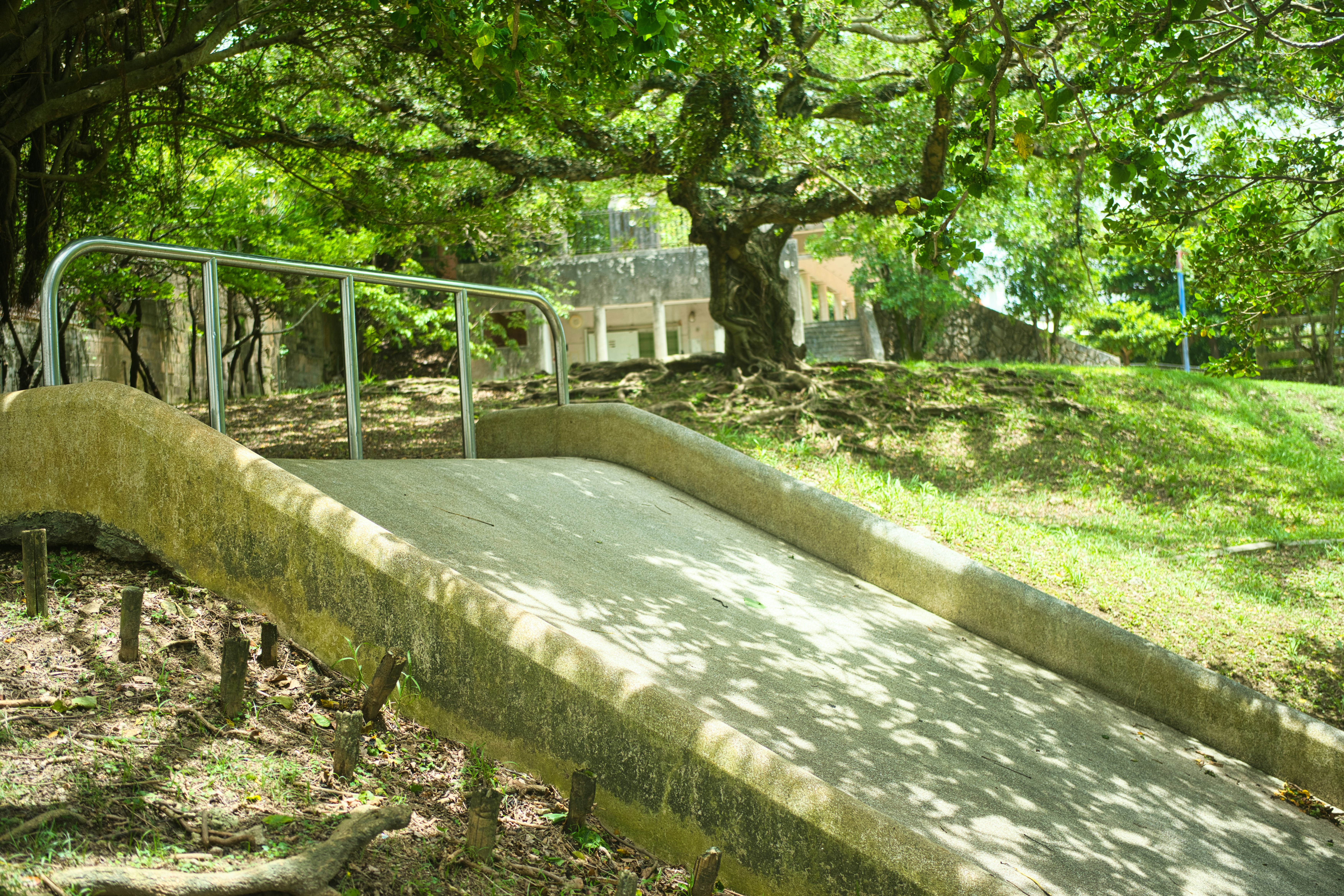 Concrete slide with metal railings