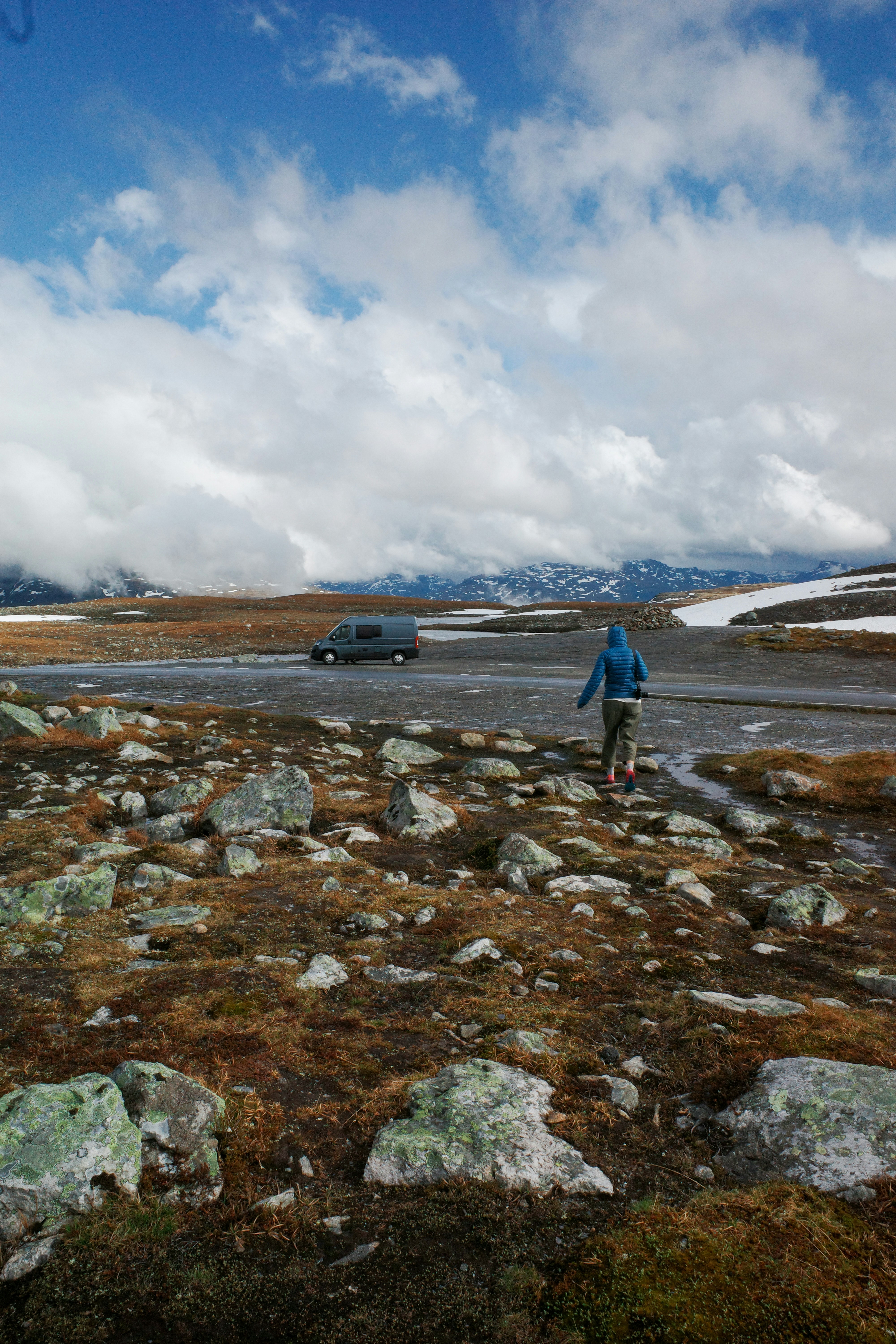 Off-road pickup trucks climbing a rocky trail in daylight