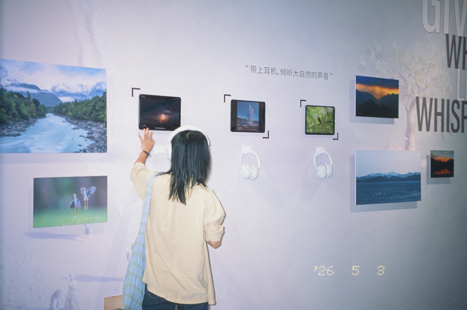 Visitor exploring a touch-navigable gallery wall