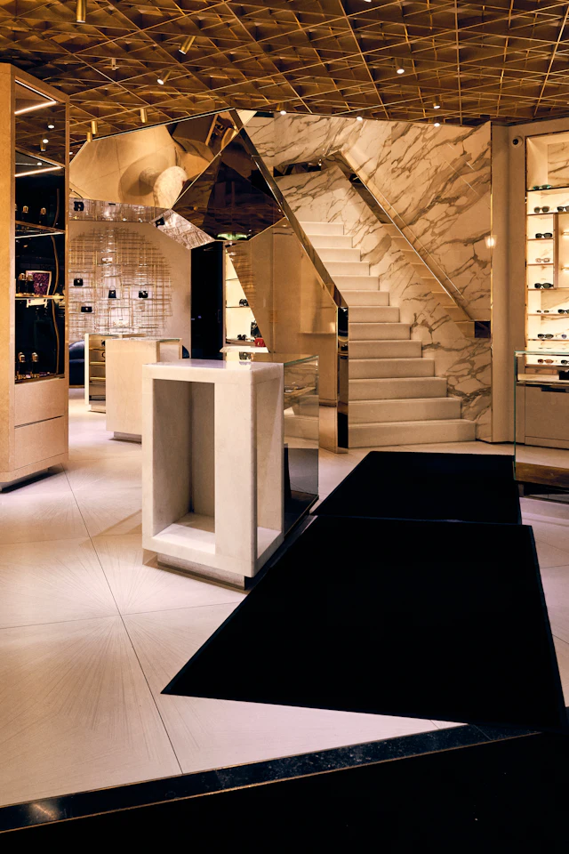 Luxurious store interior with a grand staircase and geometric ceiling