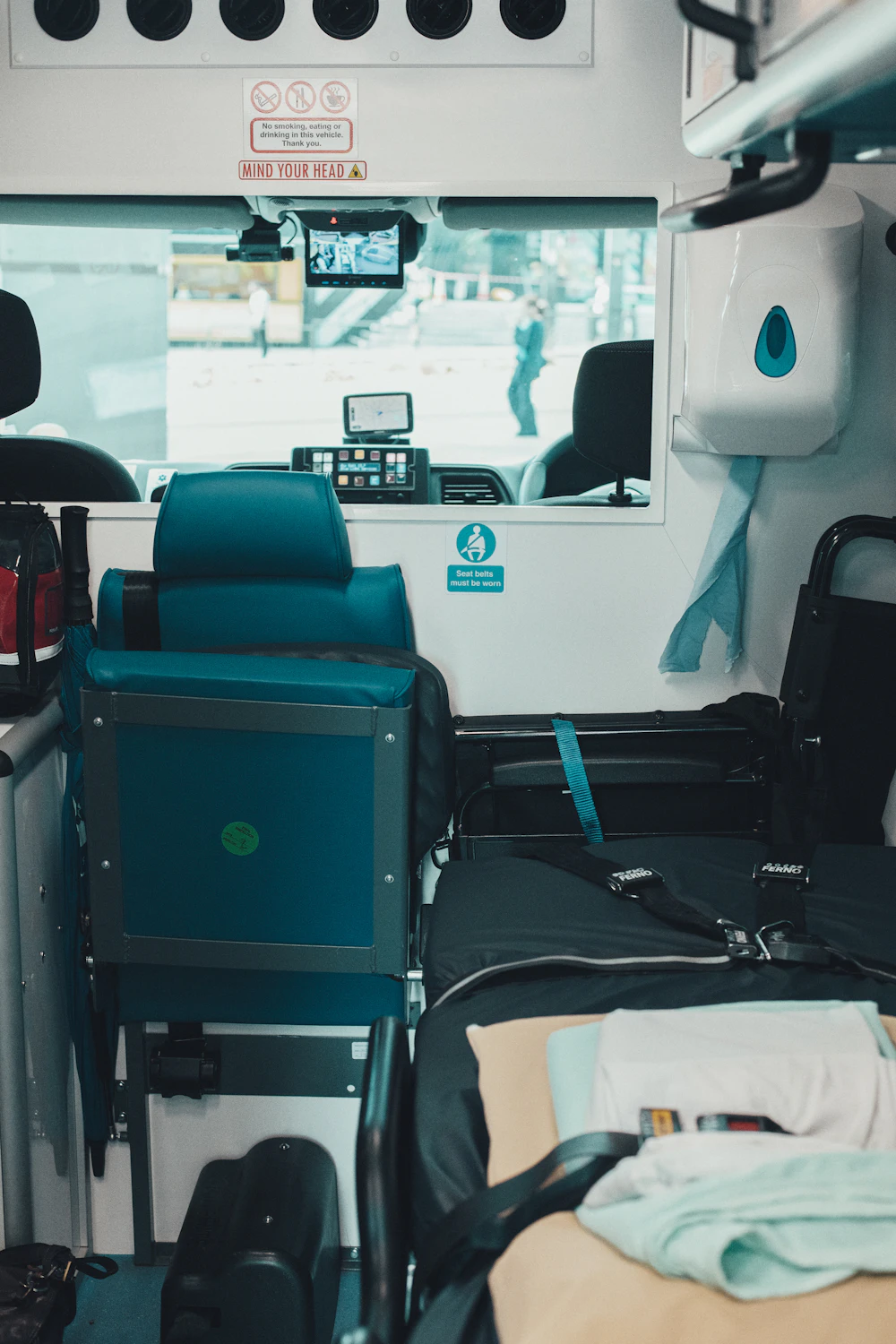 Interior of a medical transport vehicle equipped with a stretcher, representing MedBridge Cares' gurney and stretcher service