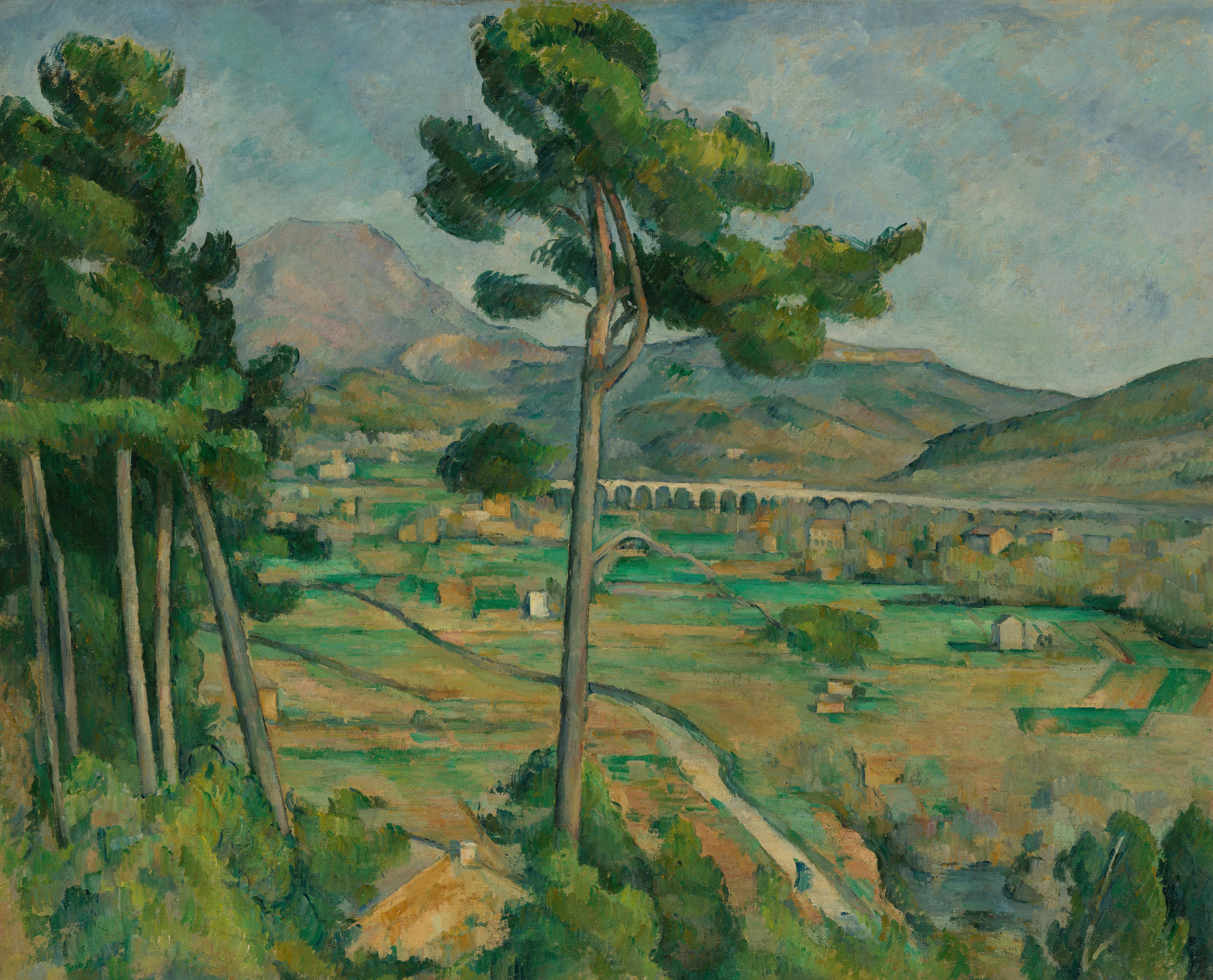 Vibrant landscape with tall pine trees, a viaduct, and mountains