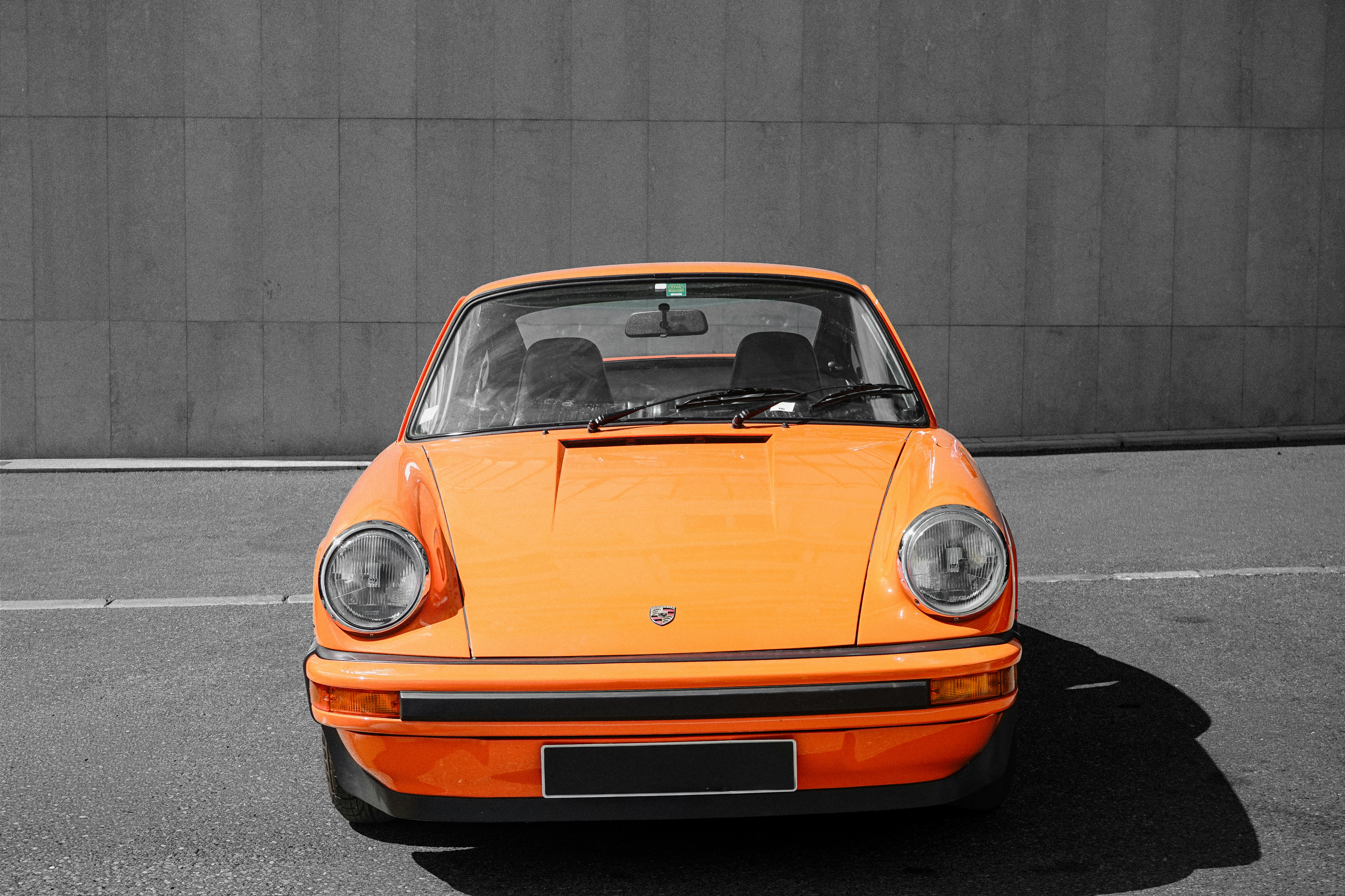 Cars Vibrant Orange Classic Car Against A Monochrome Gray Background. 4K Wallpaper #2156