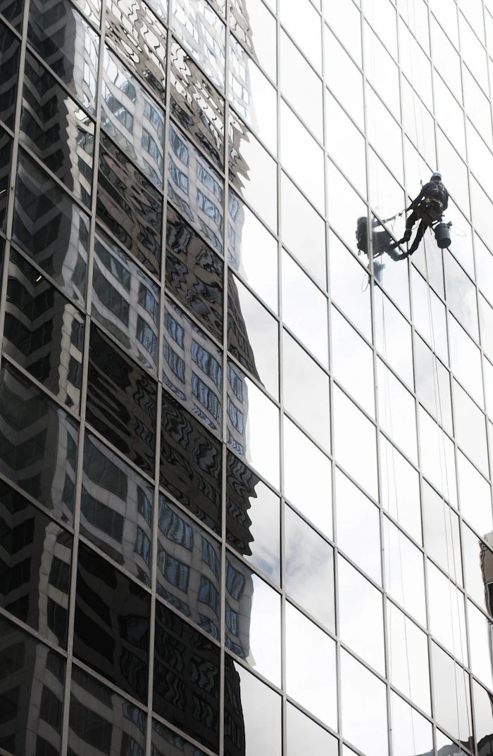 Facade cleaning on a glazed elevation