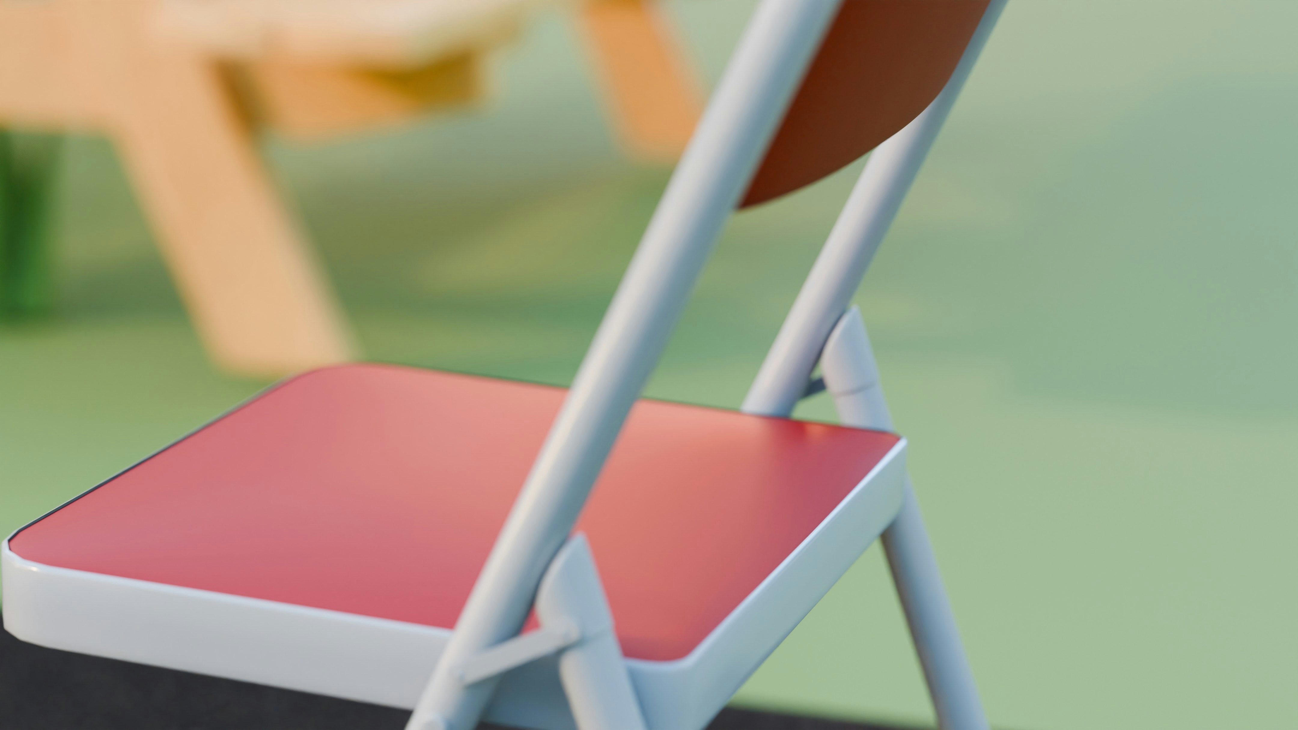 A red and white folding chair outdoors.