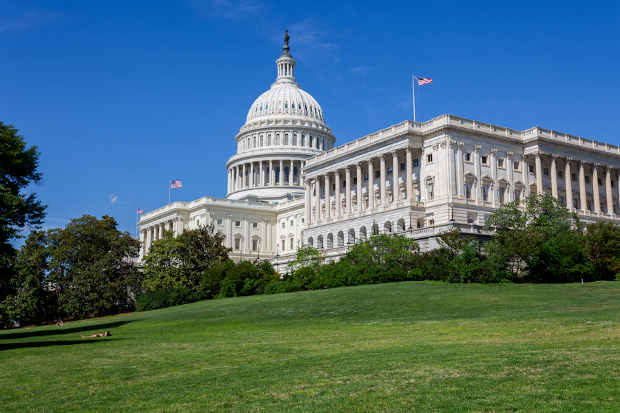 U.s. capitol building and dome under a clear blue sky.