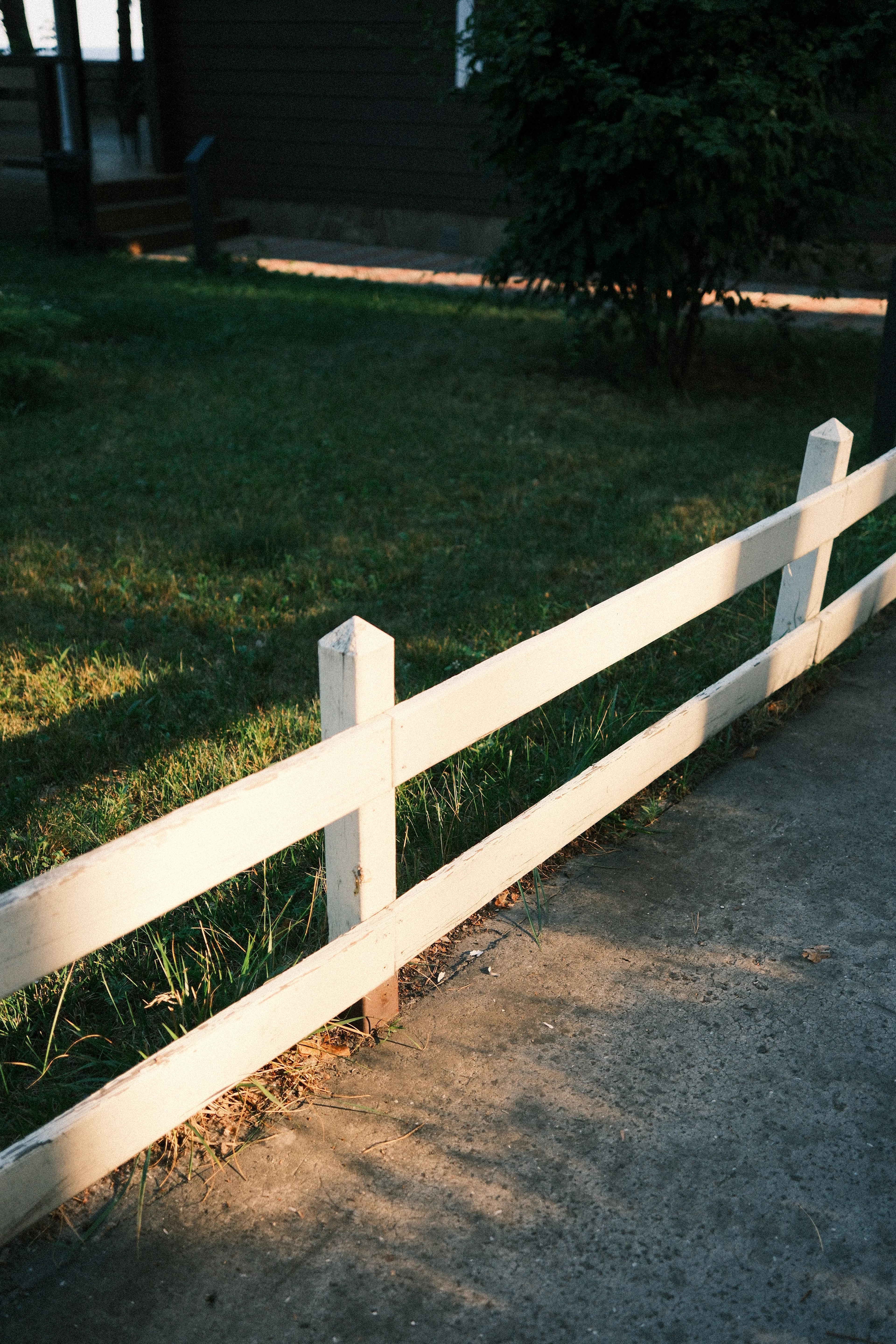 White wooden fence in warm sunlight