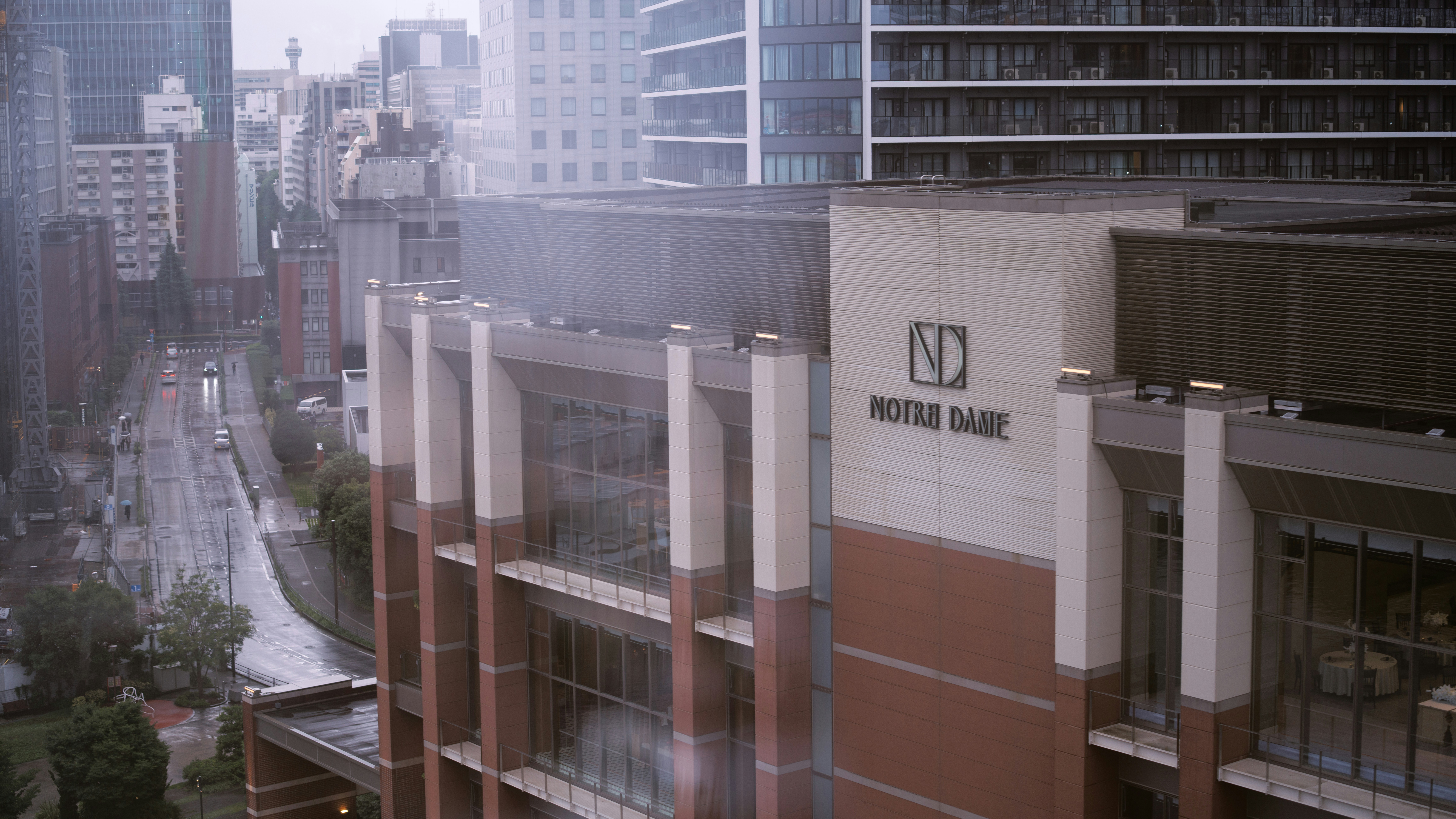 A city street with buildings, including a norde bank.
