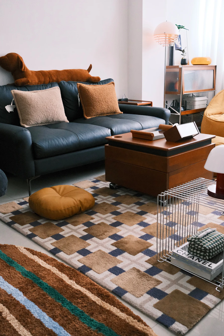 Living room with a sofa and layered patterned rugs