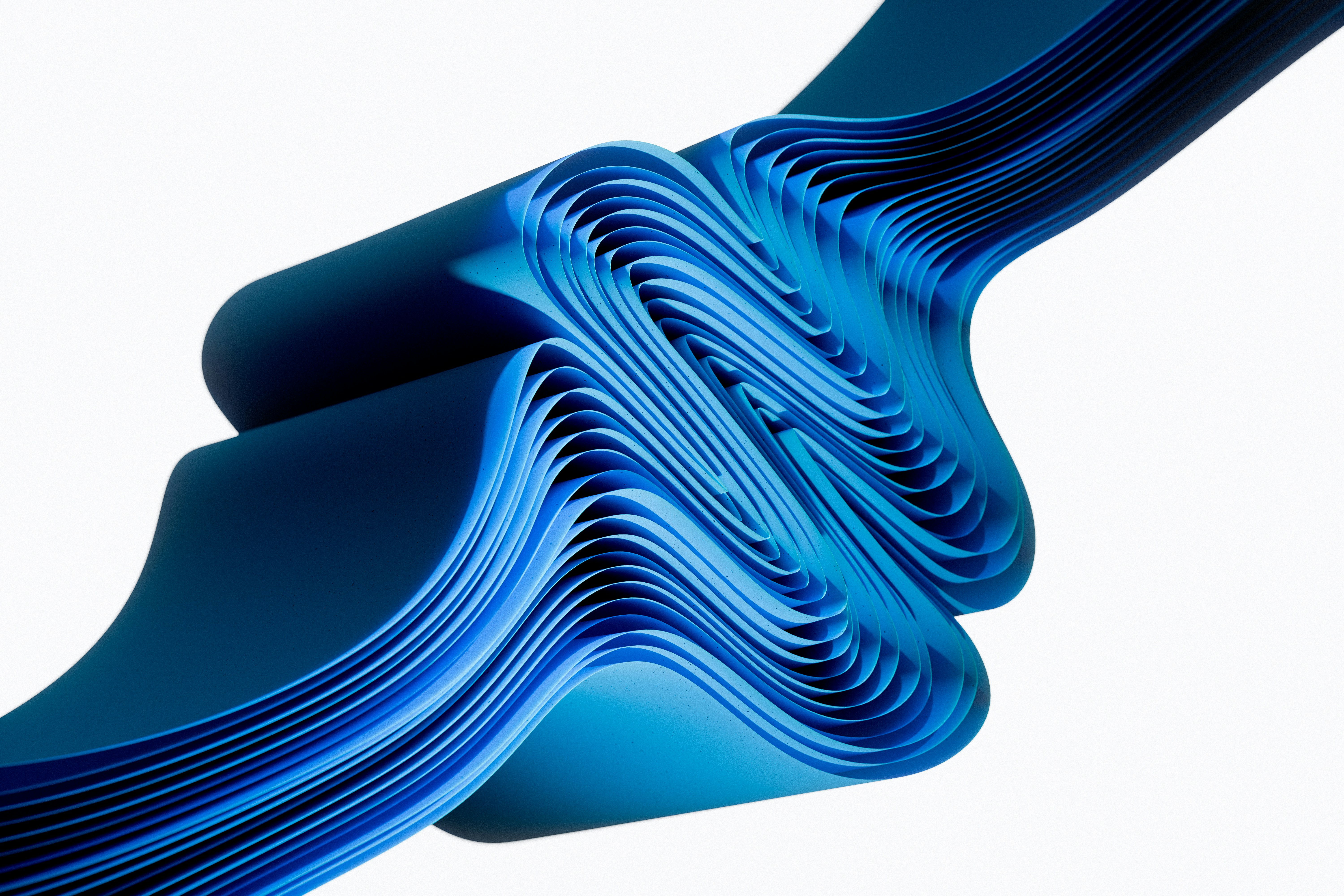 Dynamic blue wavy ribbons on a clean white background.