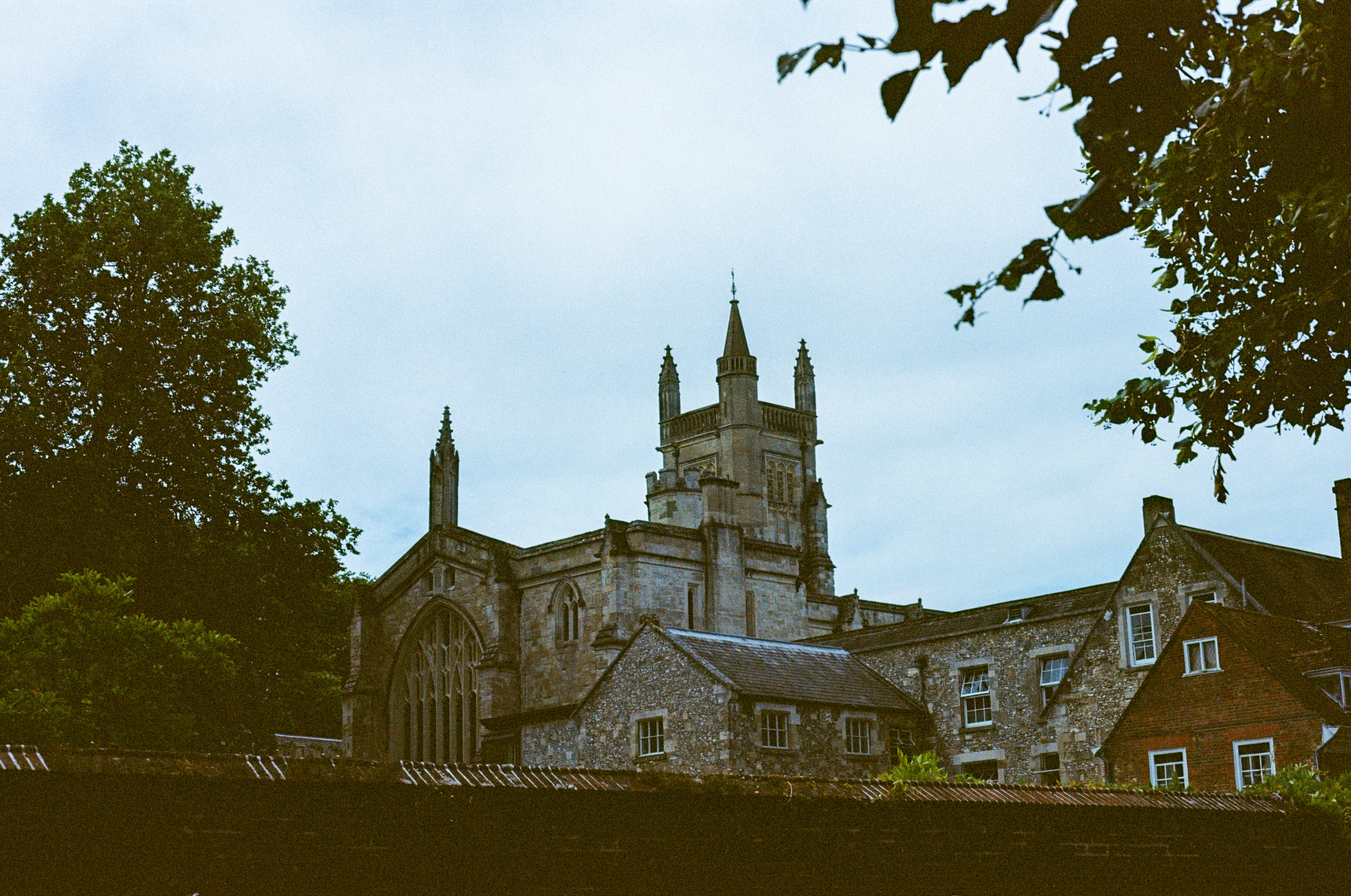Old stone abbey with tall tower and spires