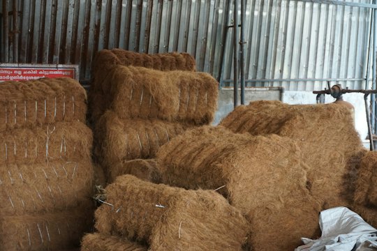 Coir fibre bales stacked in a warehouse