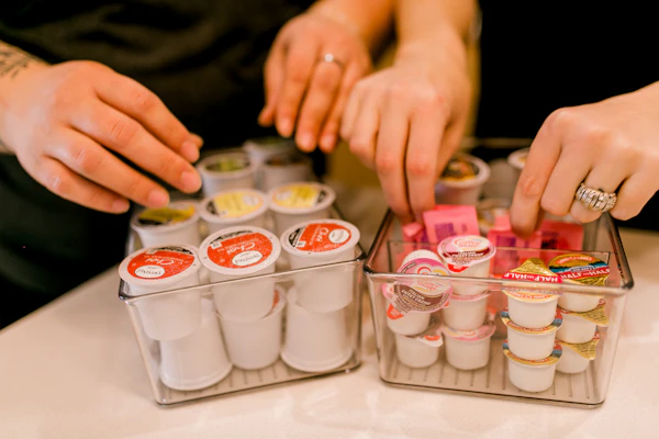 Coffee pods sorted into clear containers