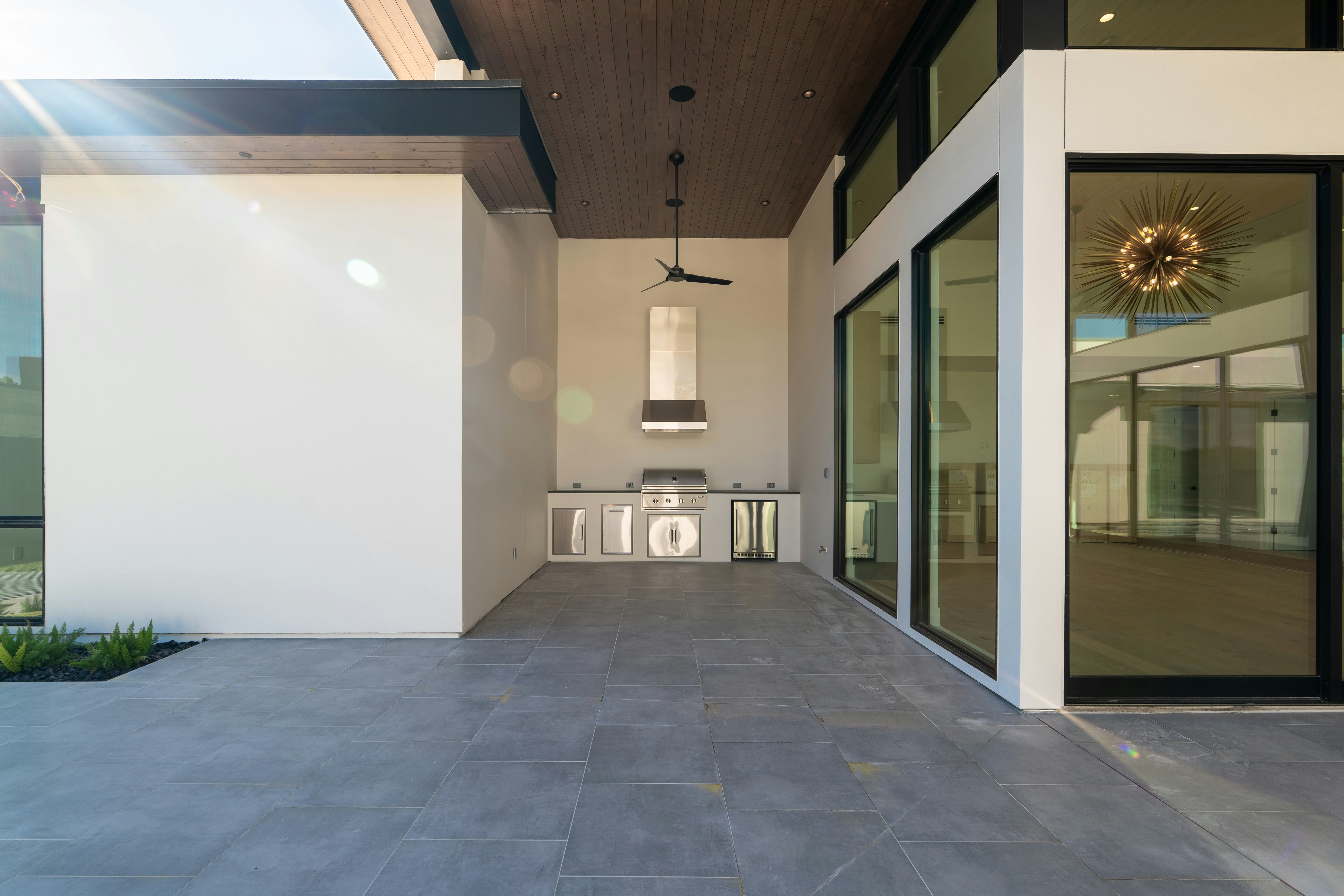 Sleek modern outdoor patio with a built-in kitchen.