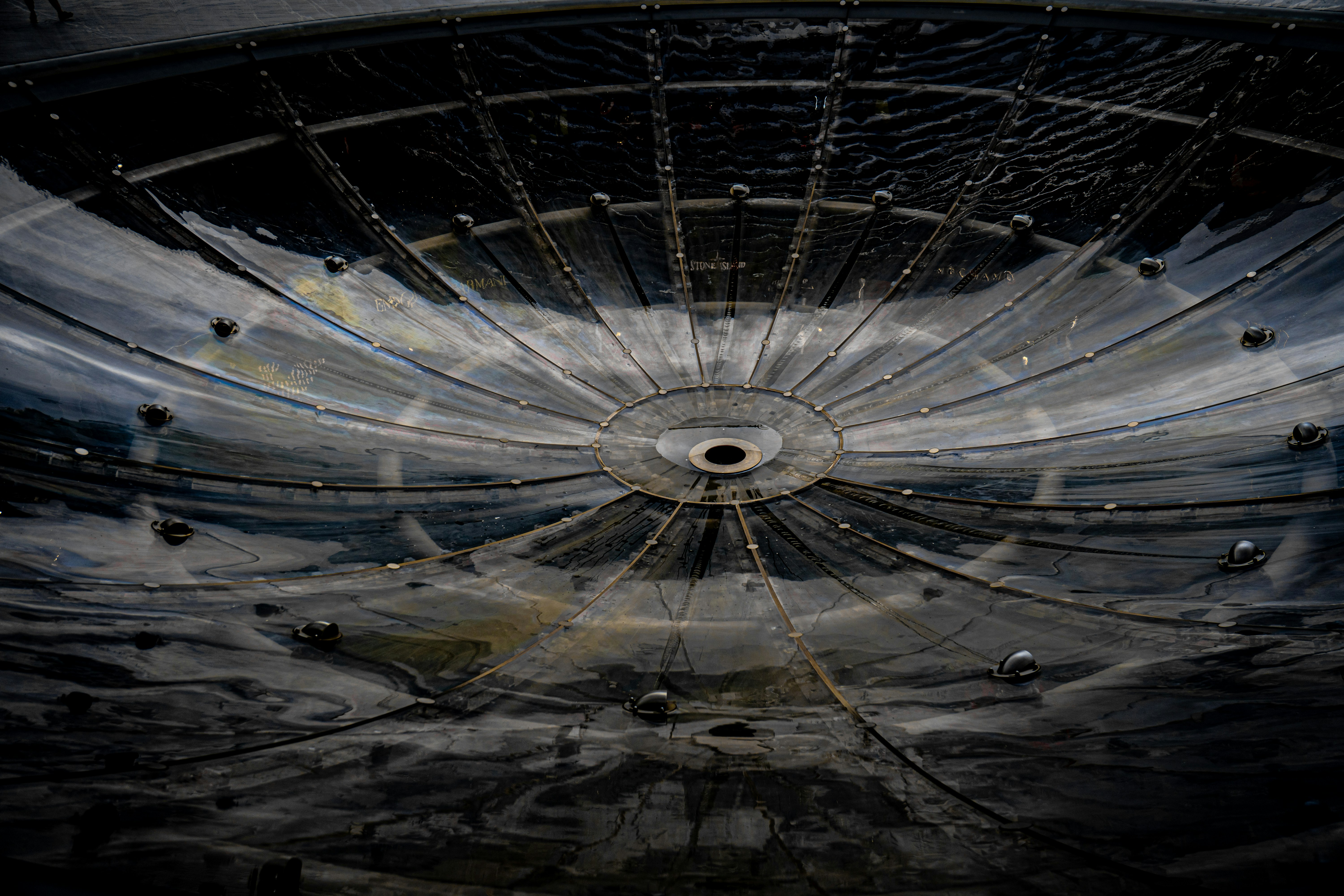 Grungy, circular industrial structure with radiating lines and central hub