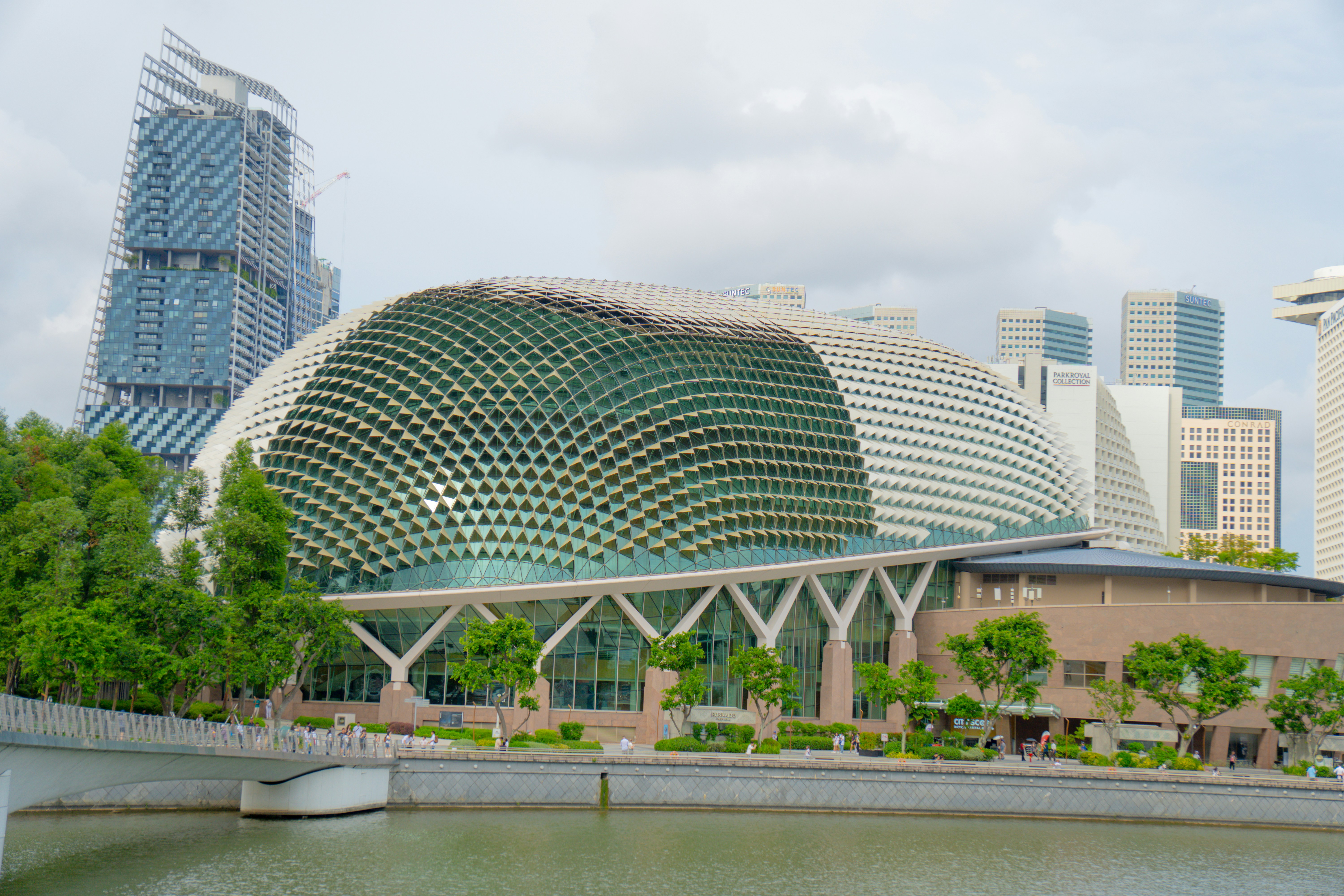 Modern esplanade theatres building with unique dome structure beside water