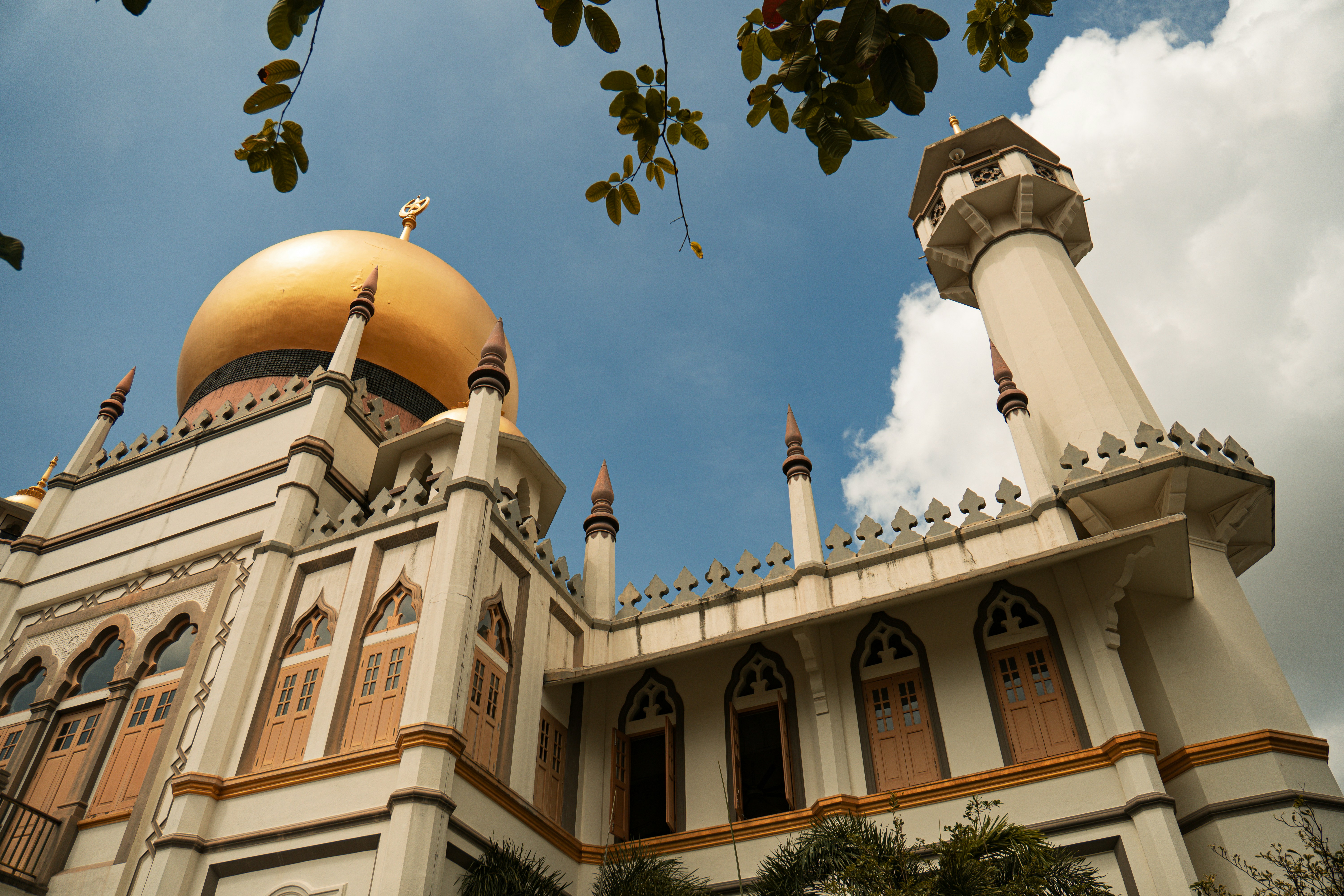 Majestic mosque with golden dome and towering minaret