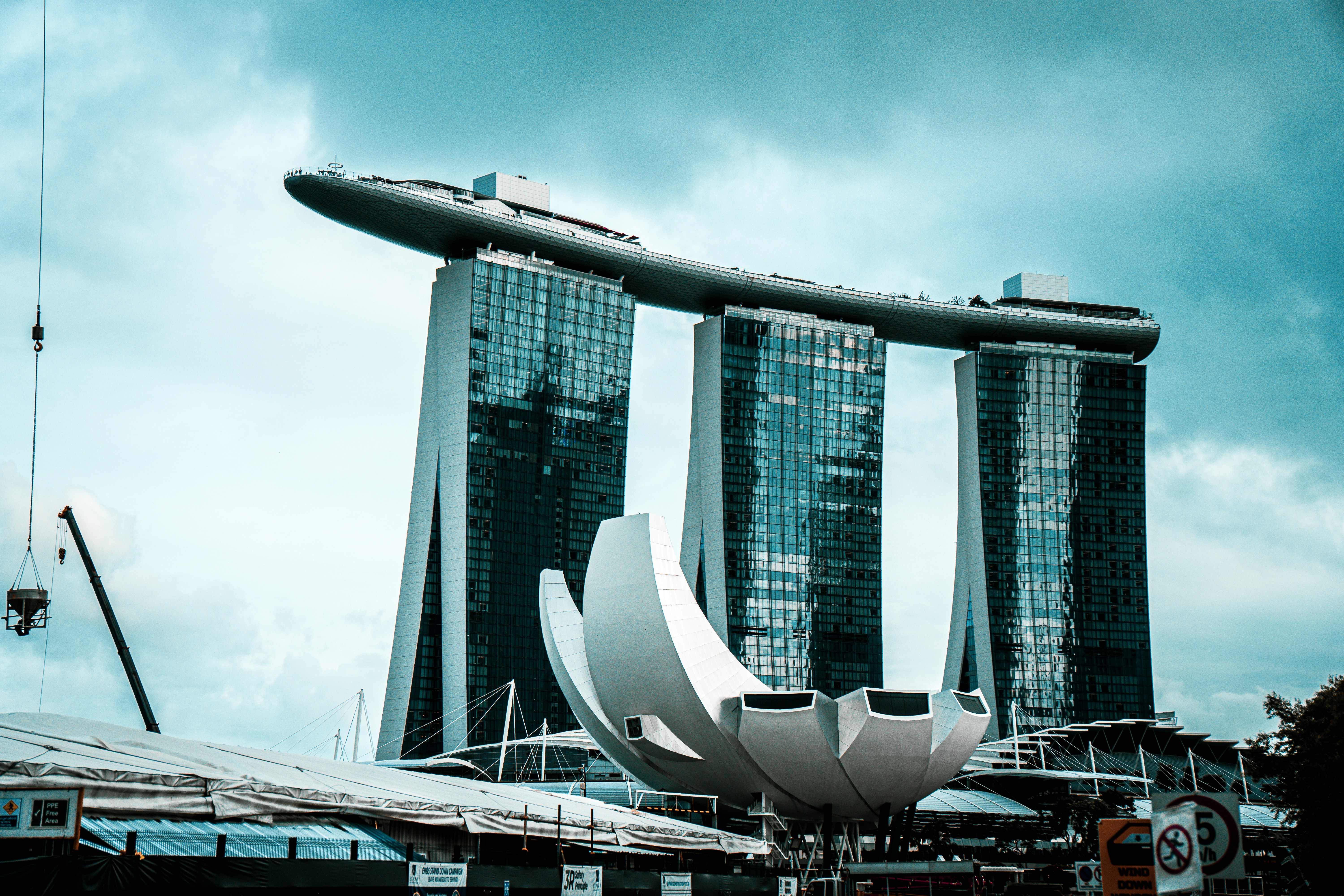 Marina bay sands and artscience museum under a cloudy sky