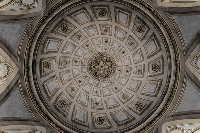 Ornate circular ceiling with intricate patterns and a central medallion