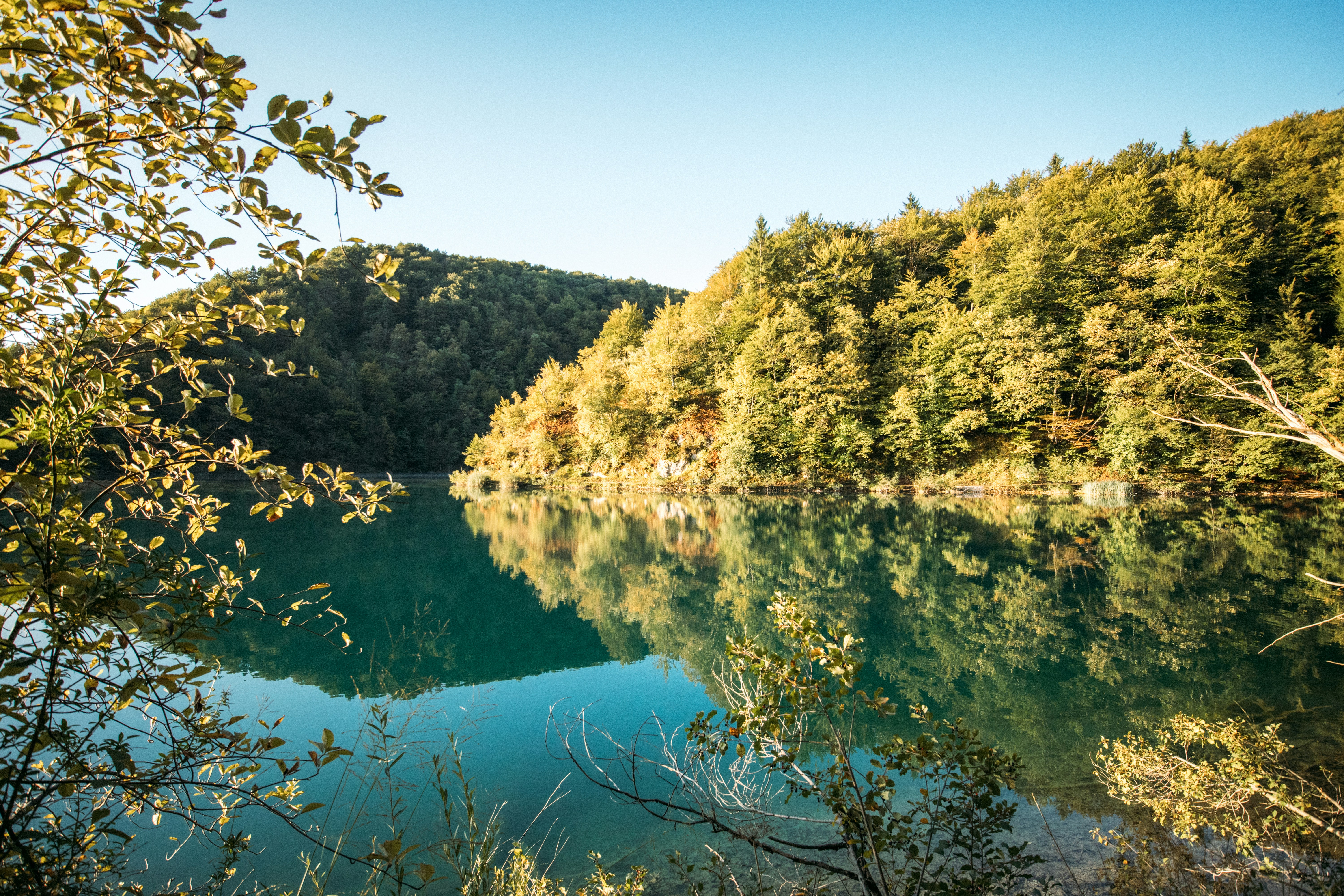 Nature Clear Blue Lake Reflecting Autumn Trees Under A Bright Sky. 4K Wallpaper #2353