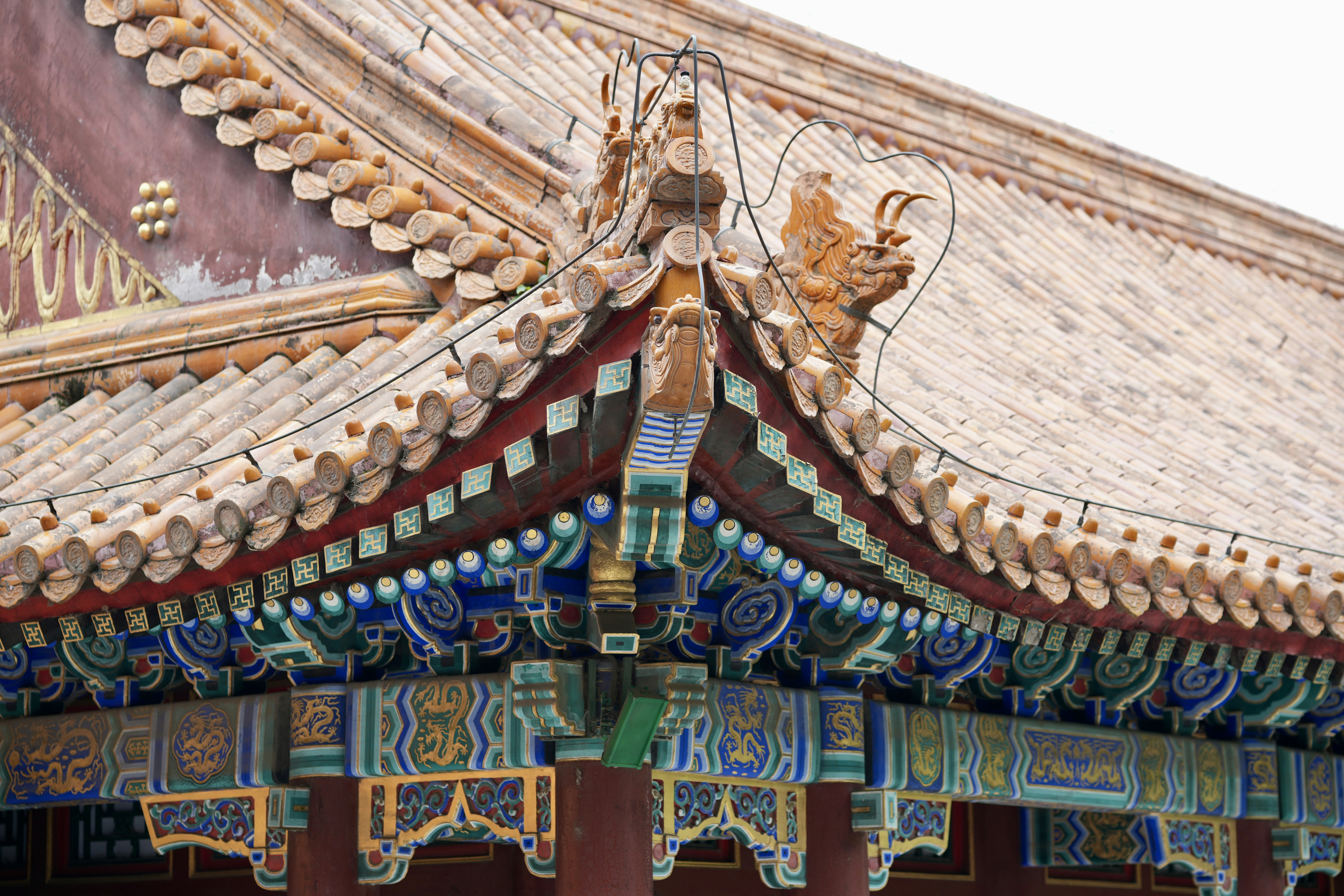 Intricate details of a traditional chinese temple roof corner.