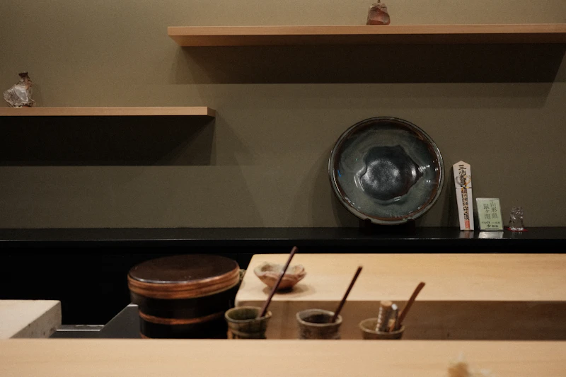 Minimalist wooden sushi counter with soft warm lighting