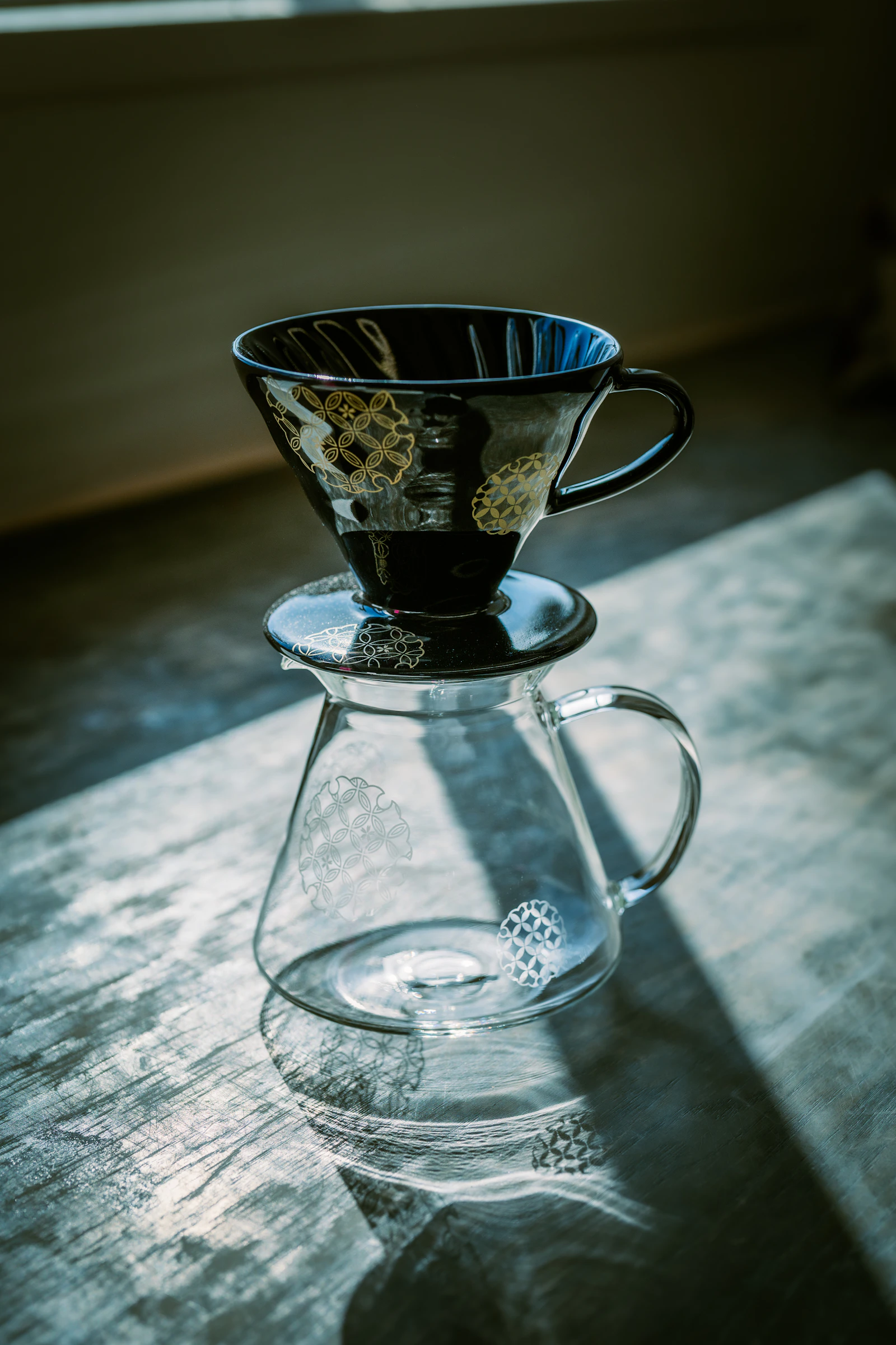 Real pour-over coffee setup with ceramic dripper and glass carafe