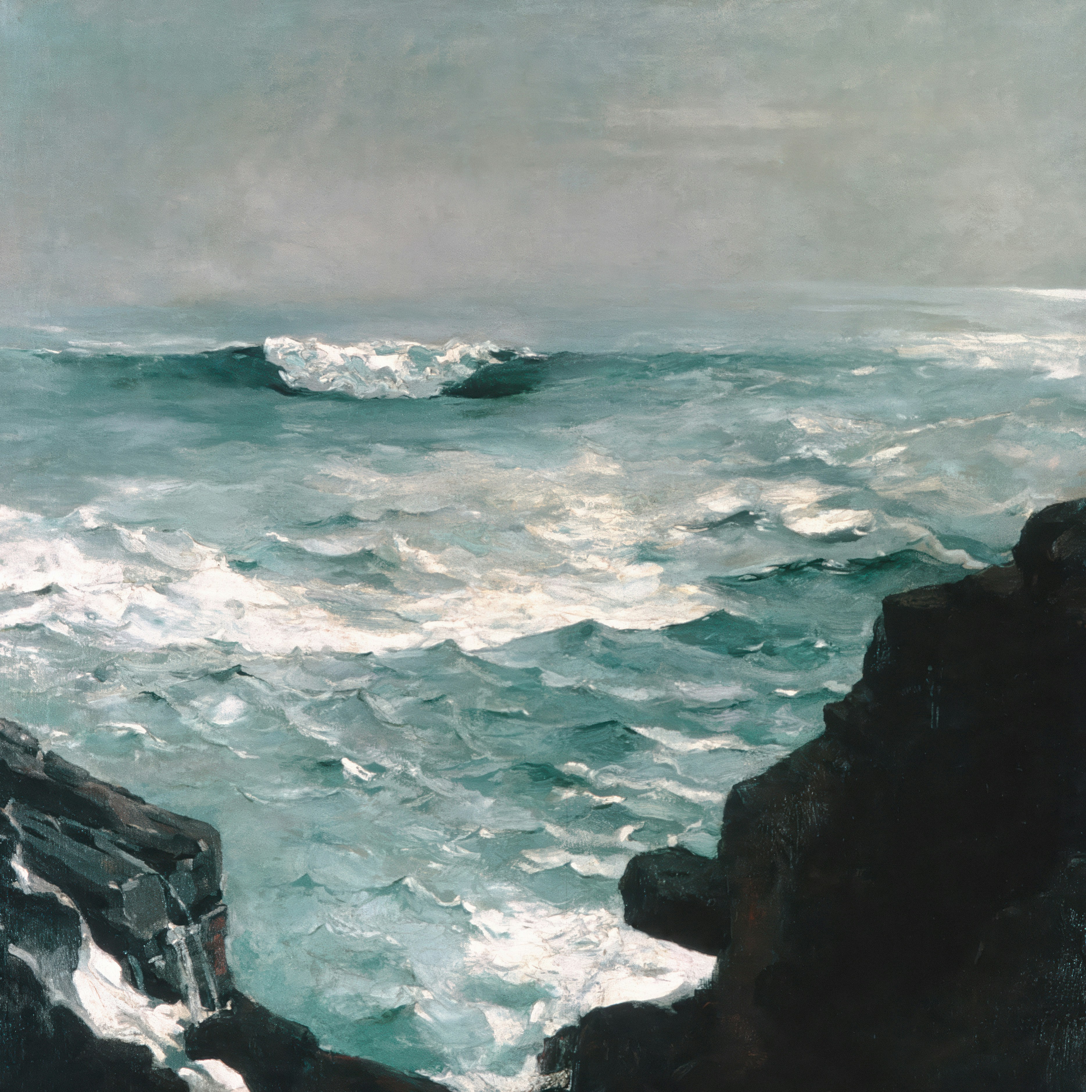 Stormy ocean waves breaking near dark rocky cliffs