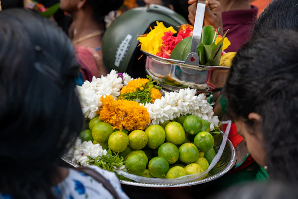 Colourful tray of limes, flowers, and mangoes pleated for a thamboolam set