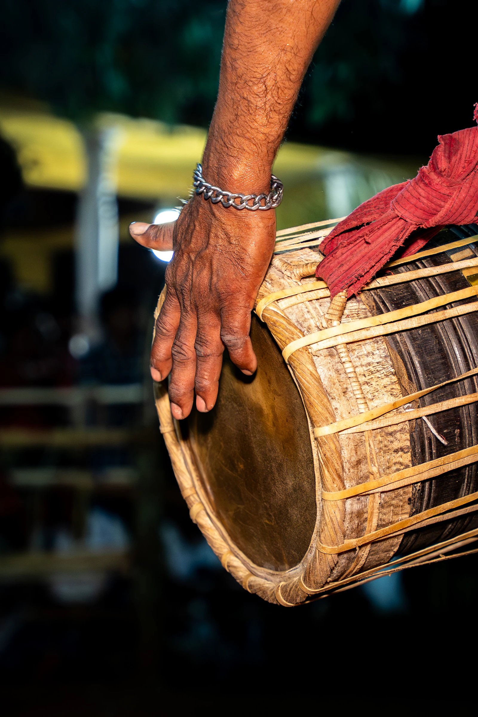 Close-up of a tabla player's hand striking the drum head