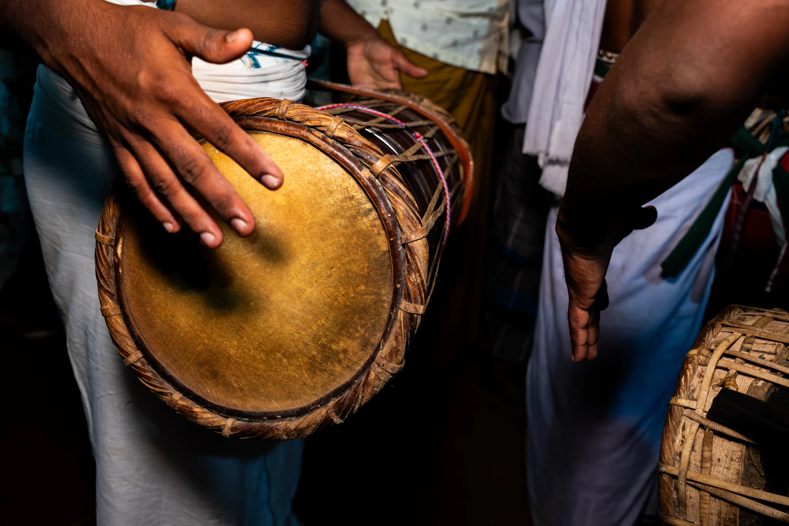 Musician playing a traditional hand drum