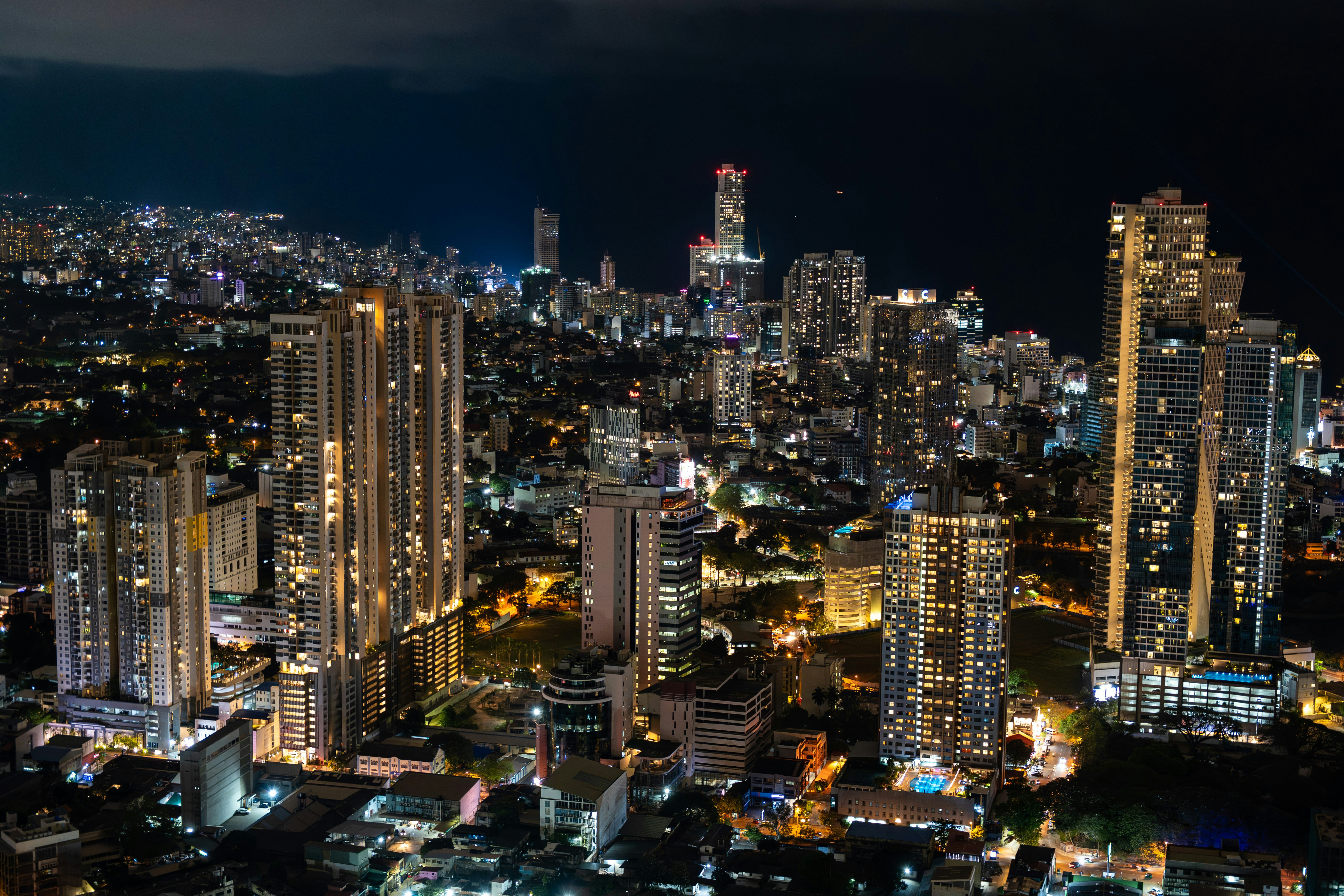 Vibrant cityscape at night with illuminated skyscrapers