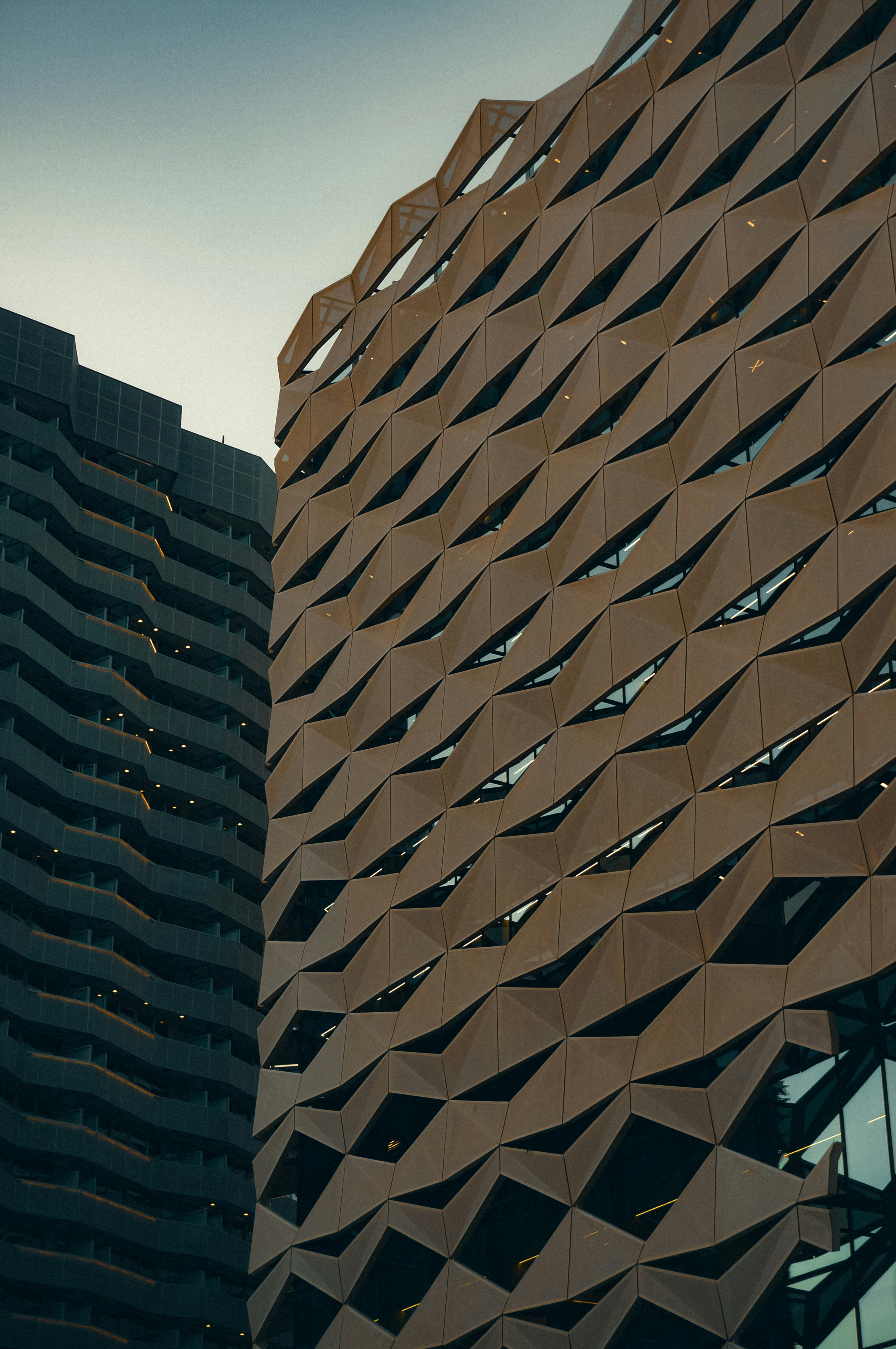 Modern buildings with geometric and wavy architectural designs.