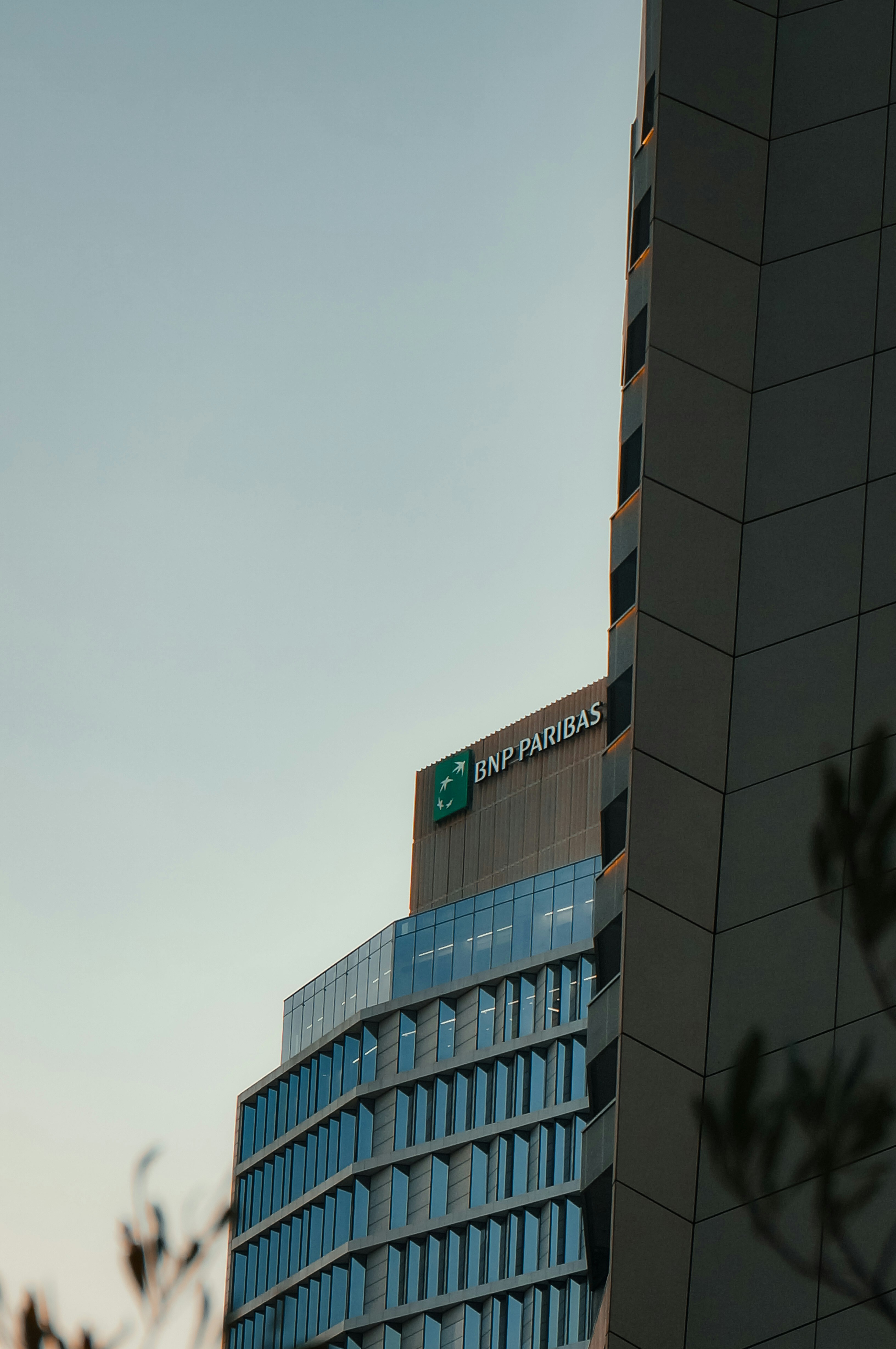 Modern bnp paribas building against a clear sky.