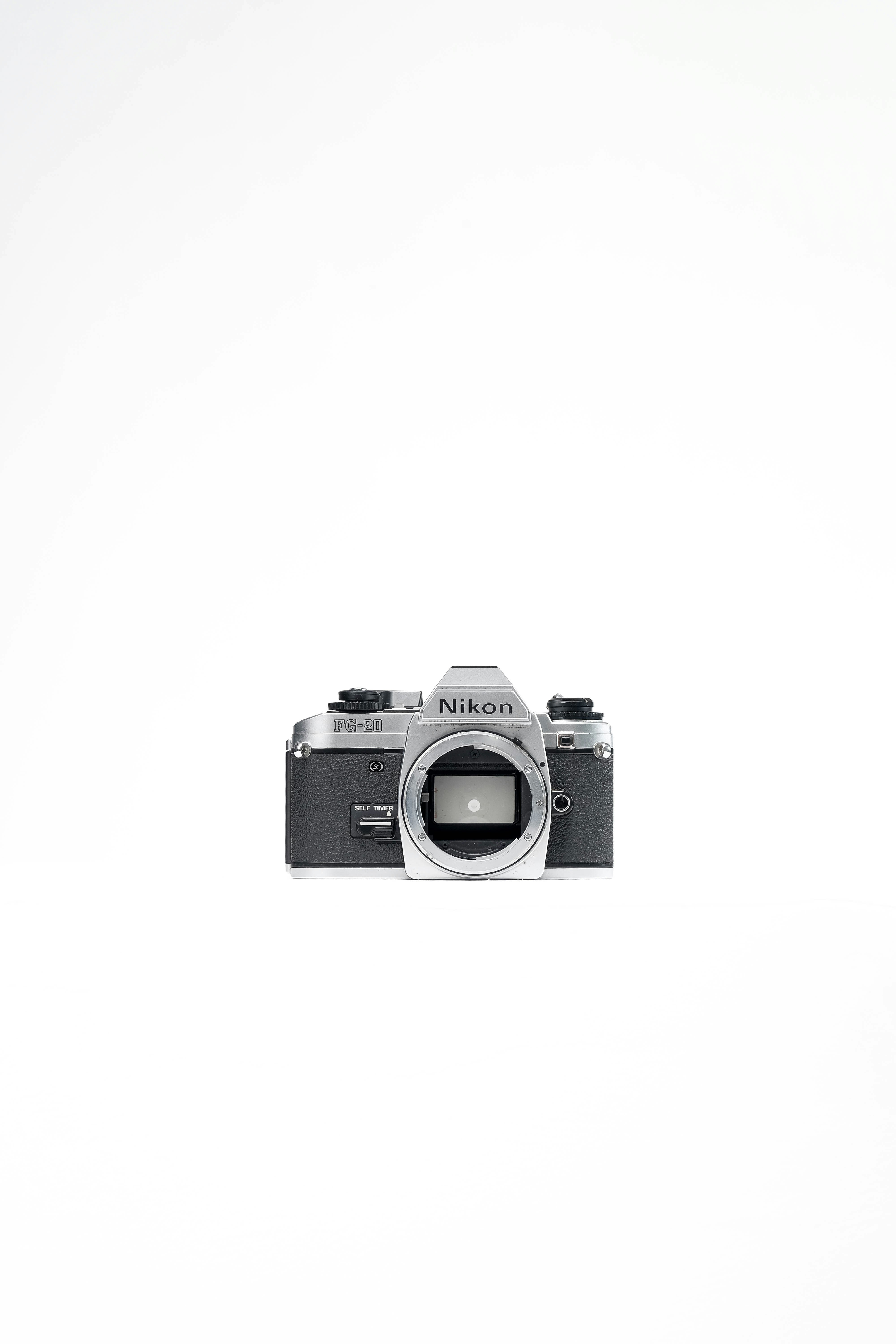 Vintage nikon camera body on white background