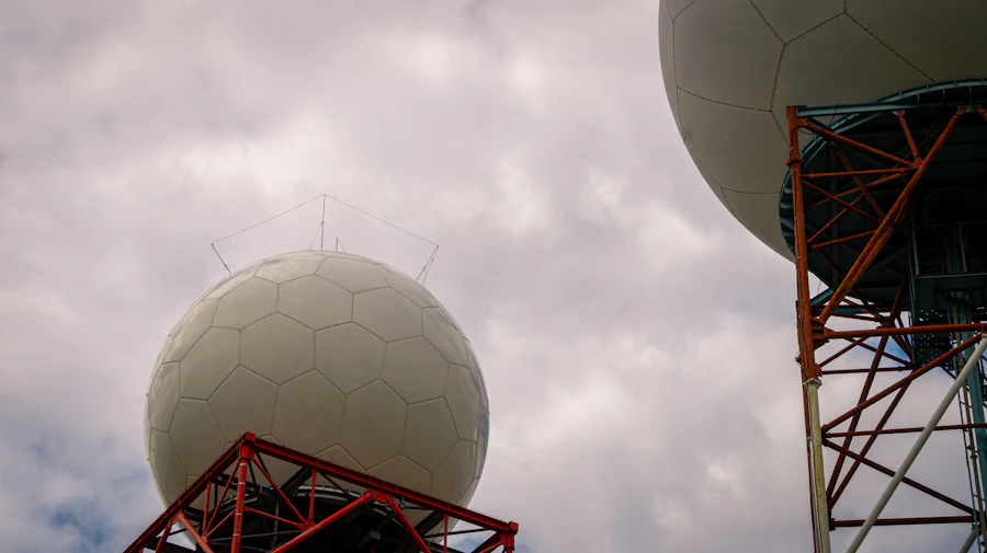 Weather radar domes on their towers against cloud