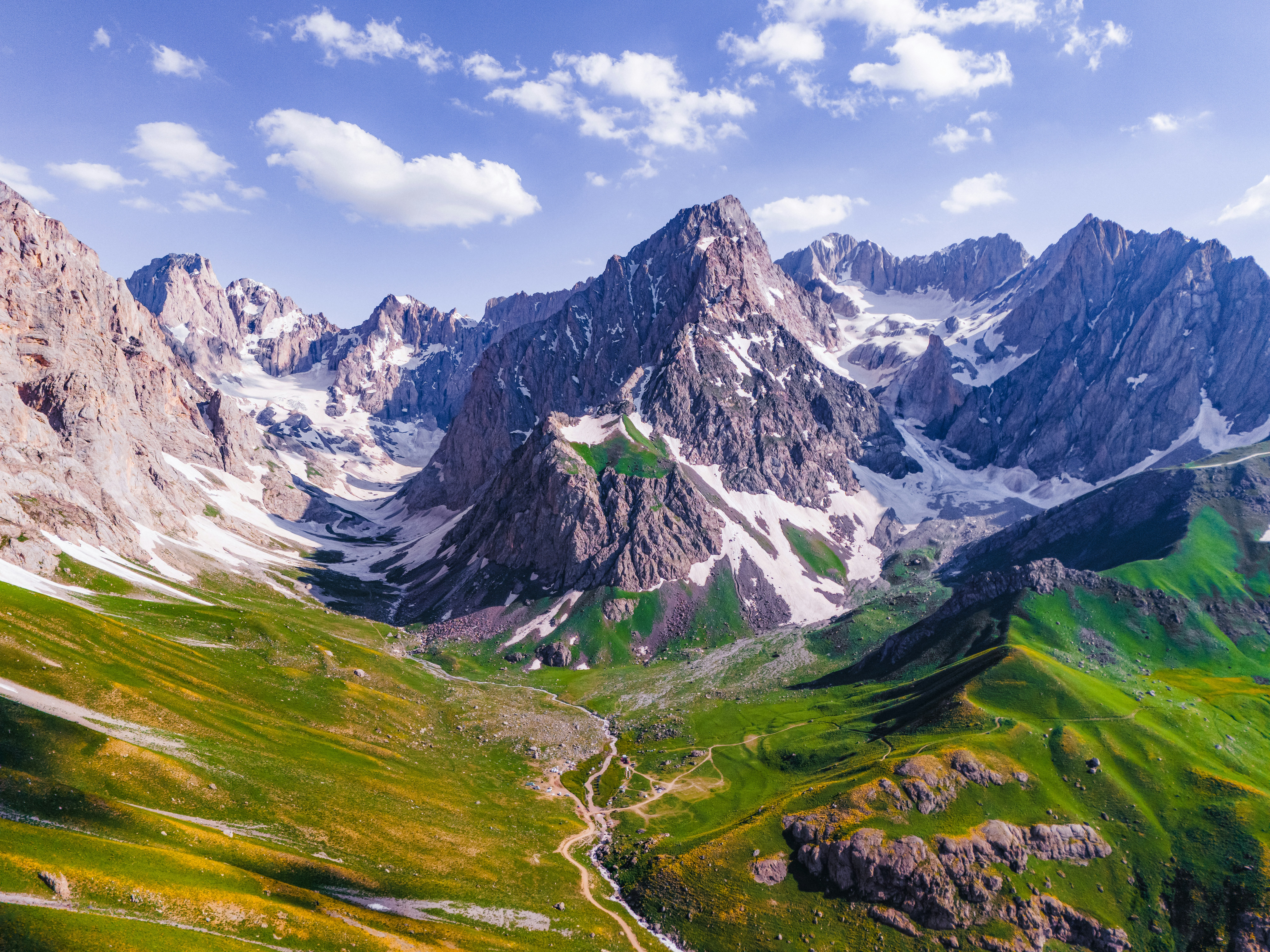 Stunning mountain landscape with green valleys and snowy peaks