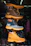 Stacked cat boots in various colors on display