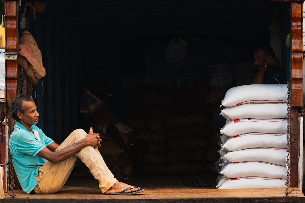 Stacked white bags of pulses ready for dispatch